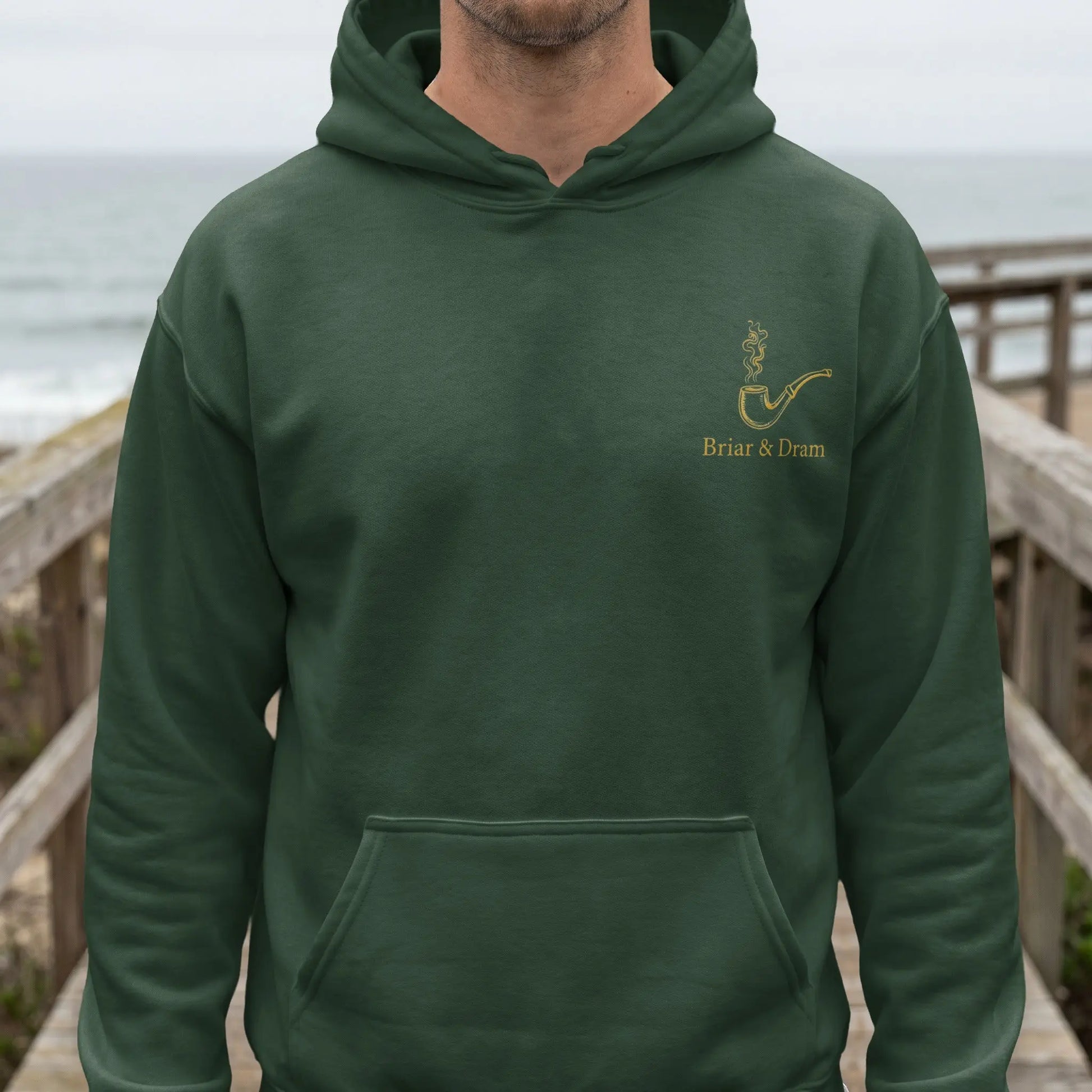 Dark green hoodie with a smoking pipe and "Briar & Dram" text on the chest.