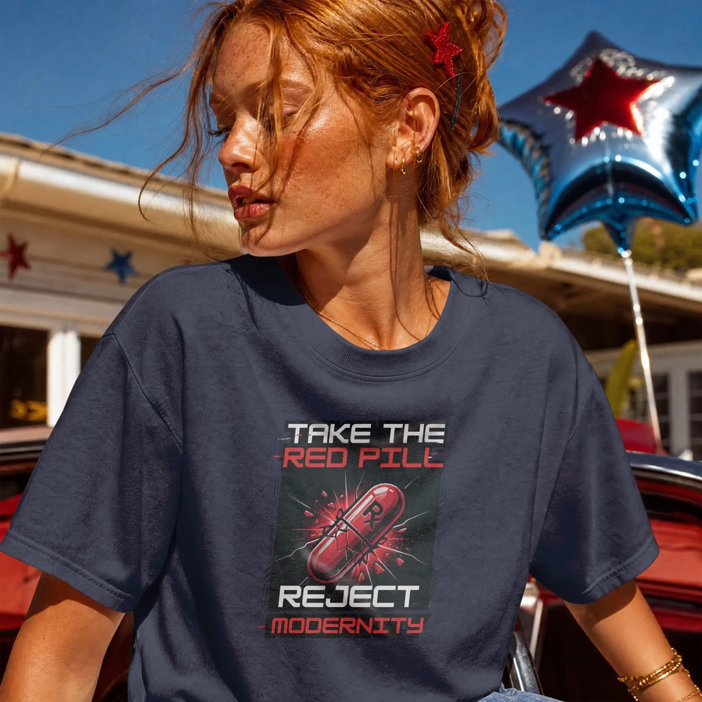 Dark blue t-shirt with "Take the Red Pill, Reject Modernity" graphic and a pill.