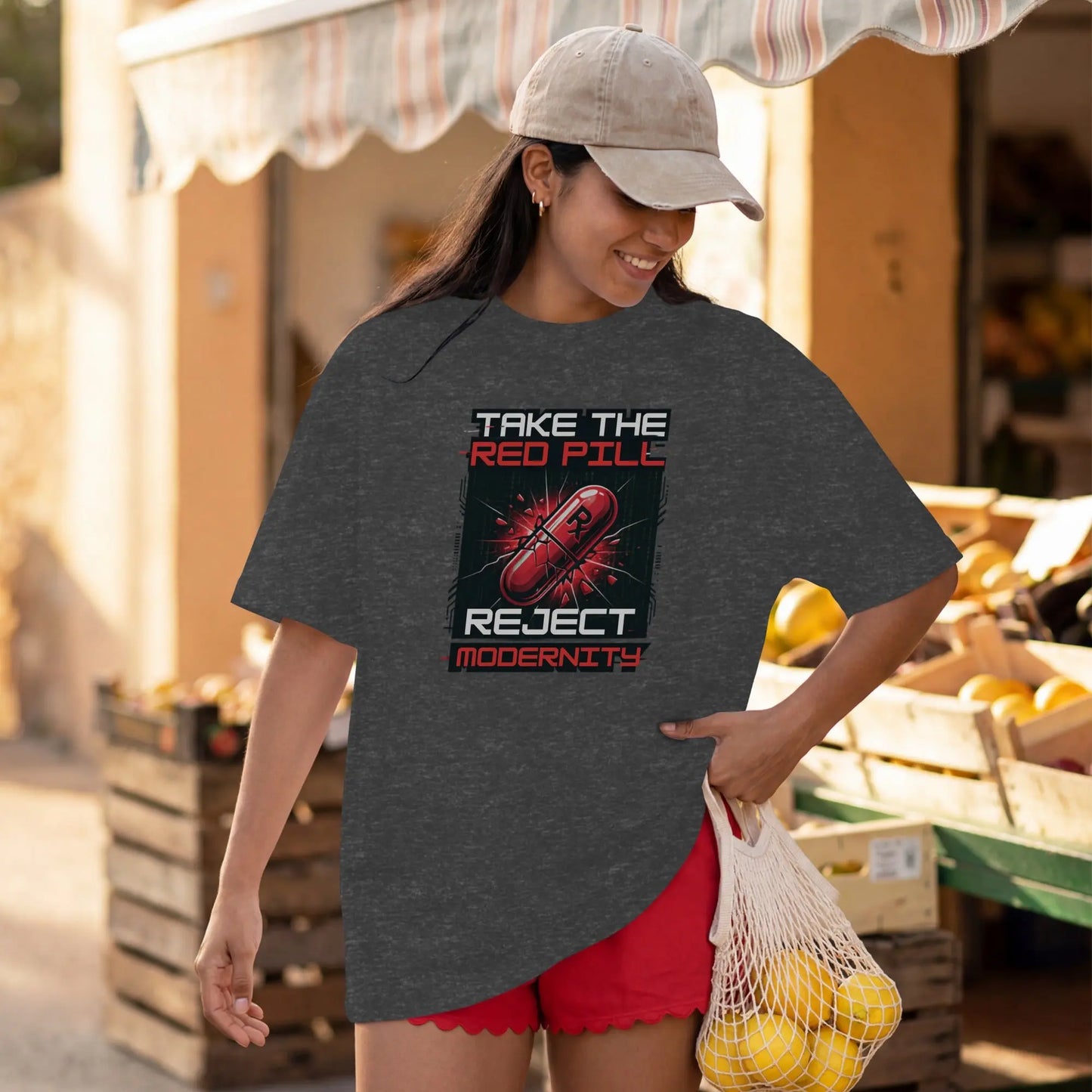 Dark t-shirt with "Take The Red Pill, Reject Modernity" text and a red capsule graphic.