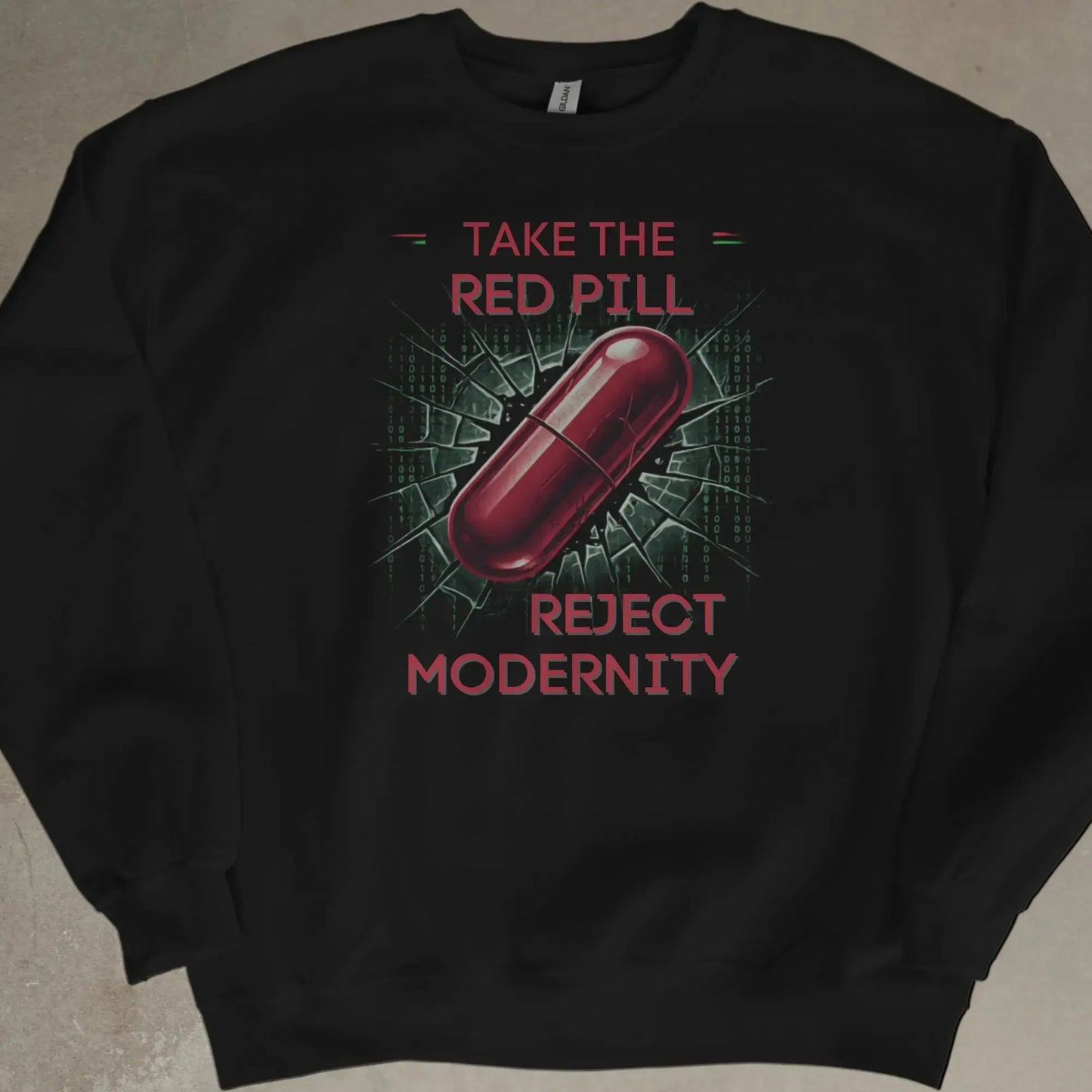 A black sweatshirt with the text "TAKE THE RED PILL REJECT MODERNITY" and a red pill graphic.