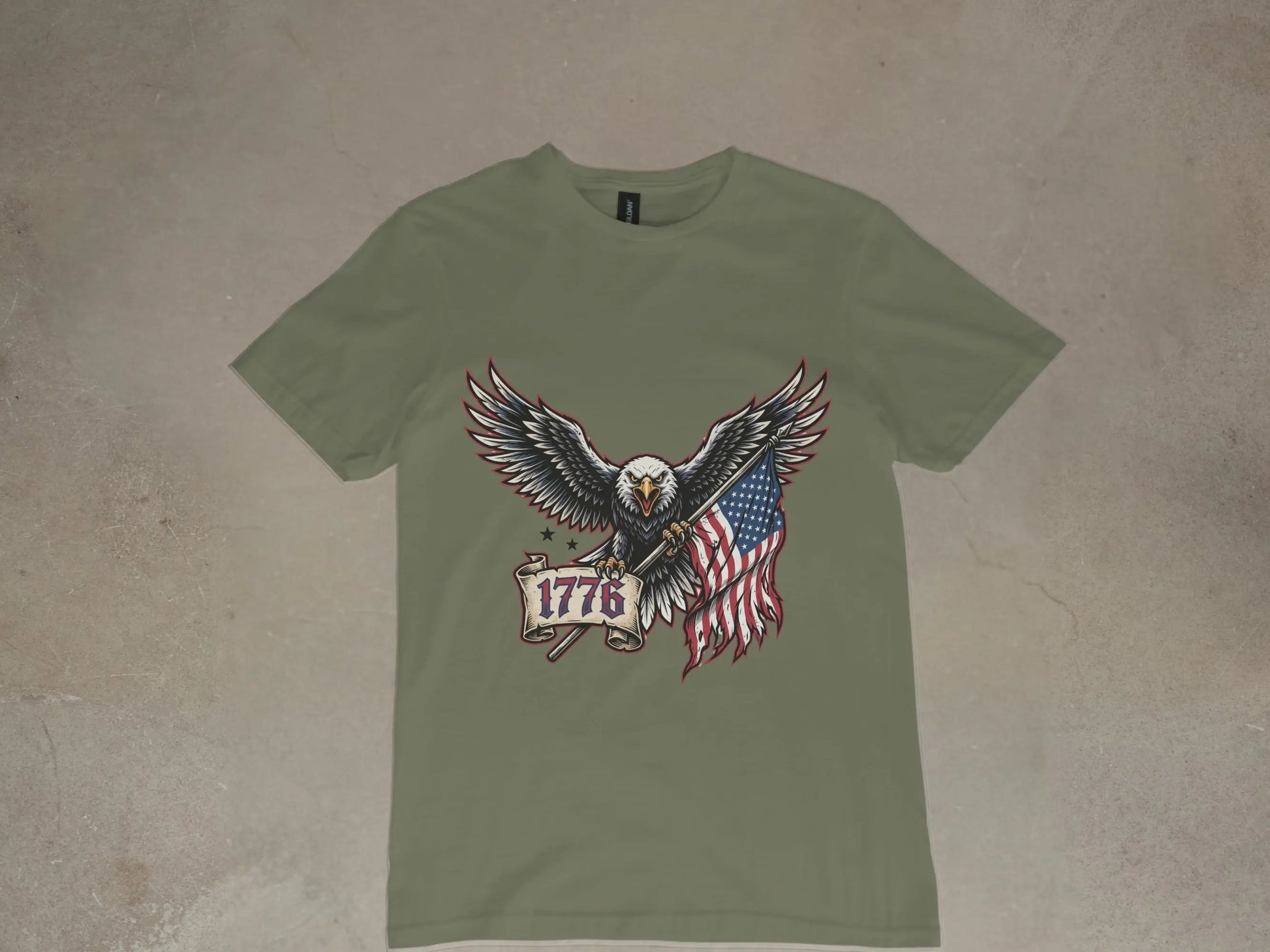 Eagle with American flag and "1776" banner on a green t-shirt.