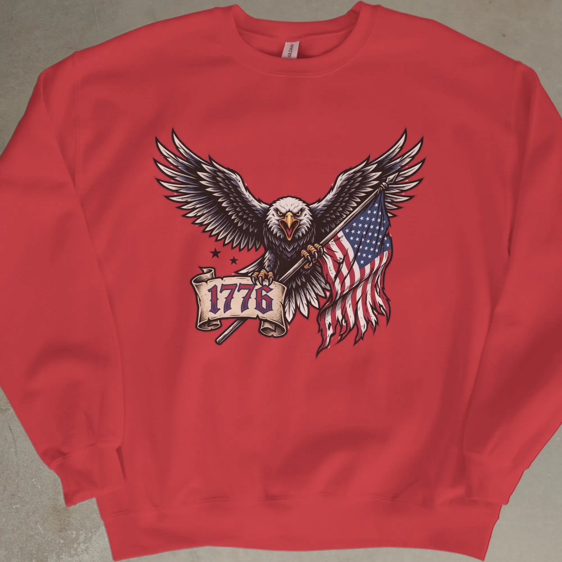 Red sweatshirt with eagle holding American flag and banner with 1776.