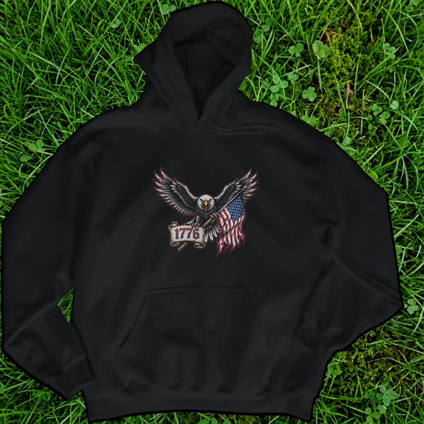 Black hoodie with an eagle holding an American flag and banner reading "1776".