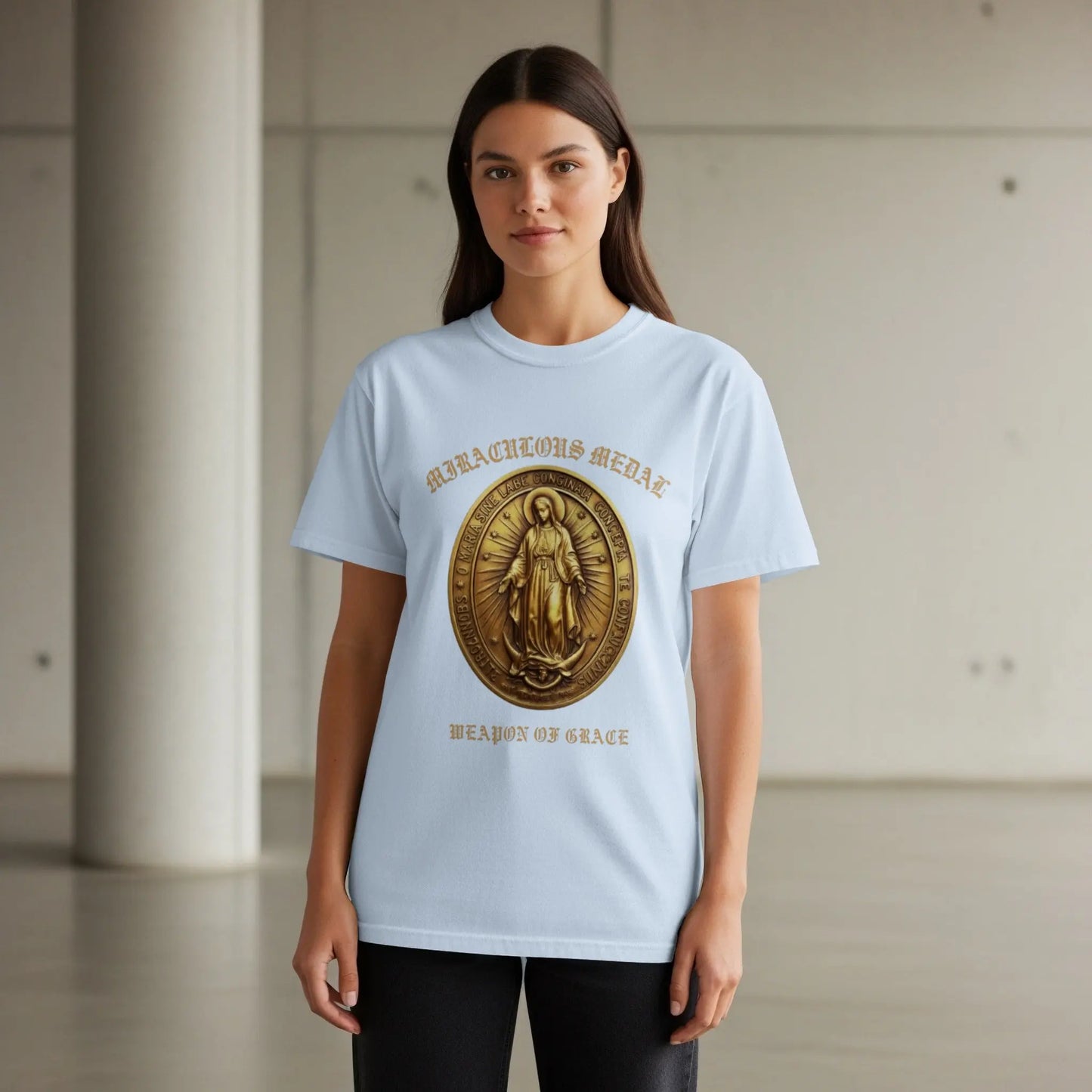 Light blue t-shirt with "Miraculous Medal" and "Weapon of Grace" print.