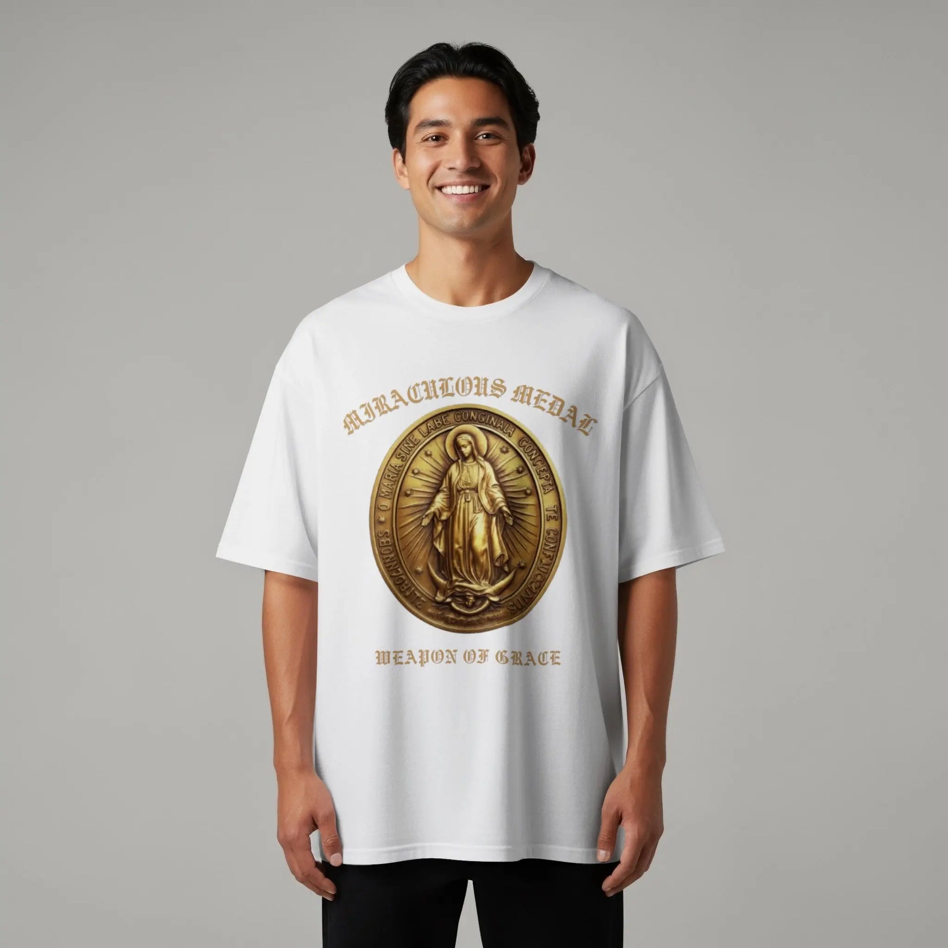 White t-shirt with gold "Miraculous Medal Weapon of Grace" text and image.