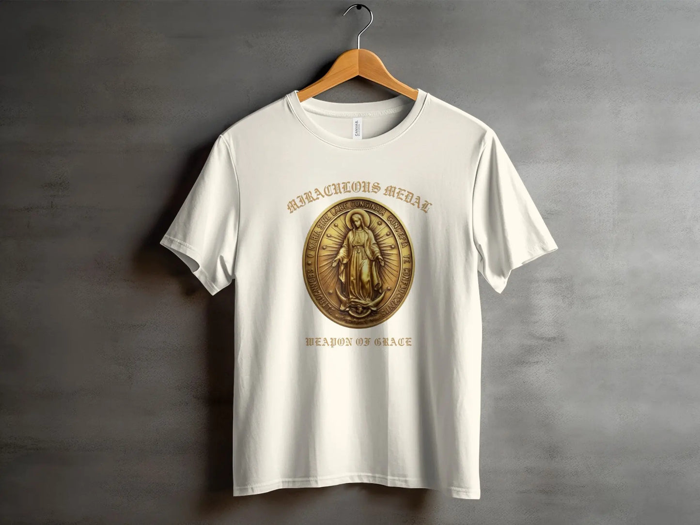 White t-shirt with Miraculous Medal graphic and "Weapon of Grace" text.