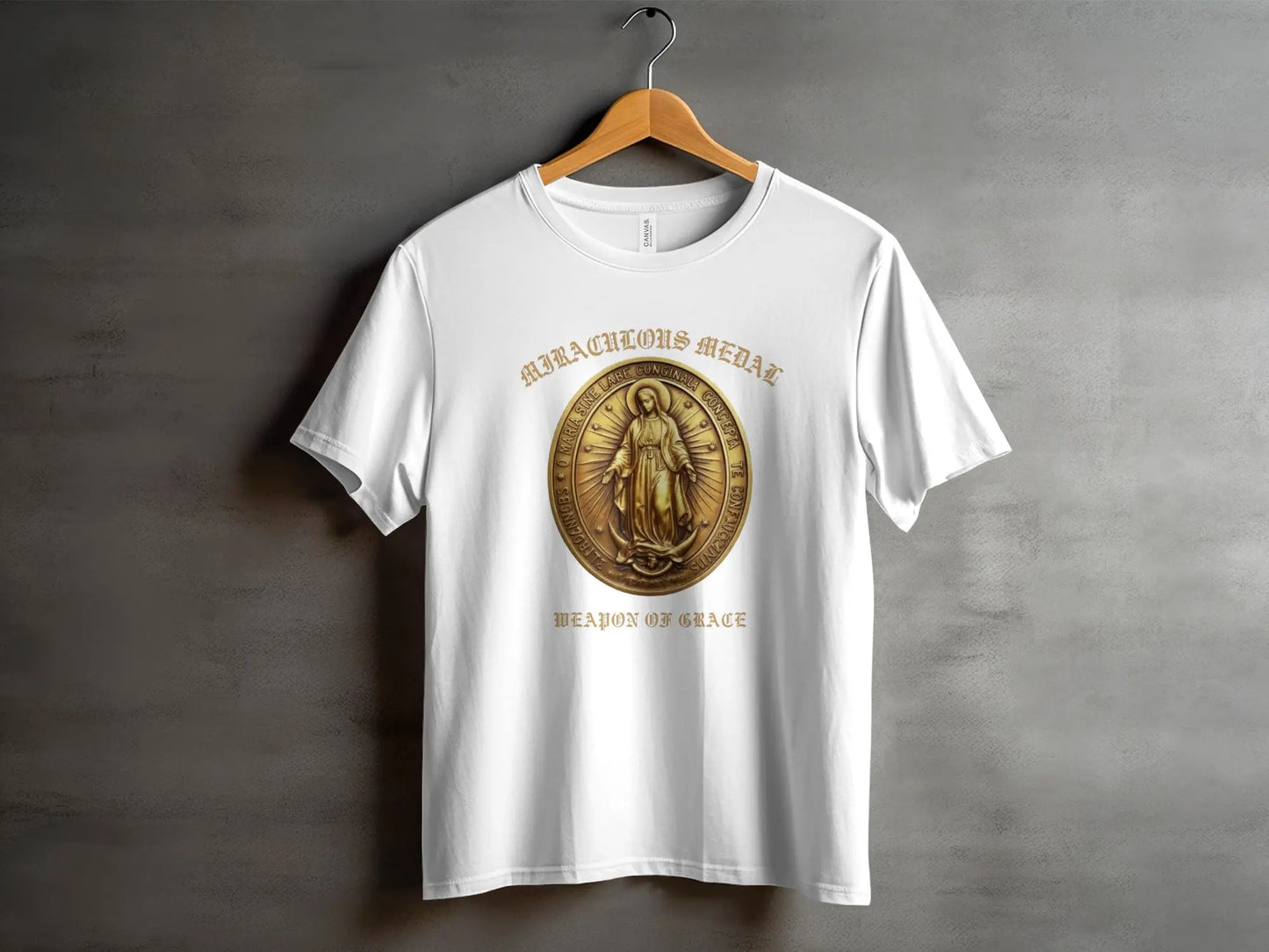 White t-shirt with "Miraculous Medal Weapon of Grace" text and a medal graphic.