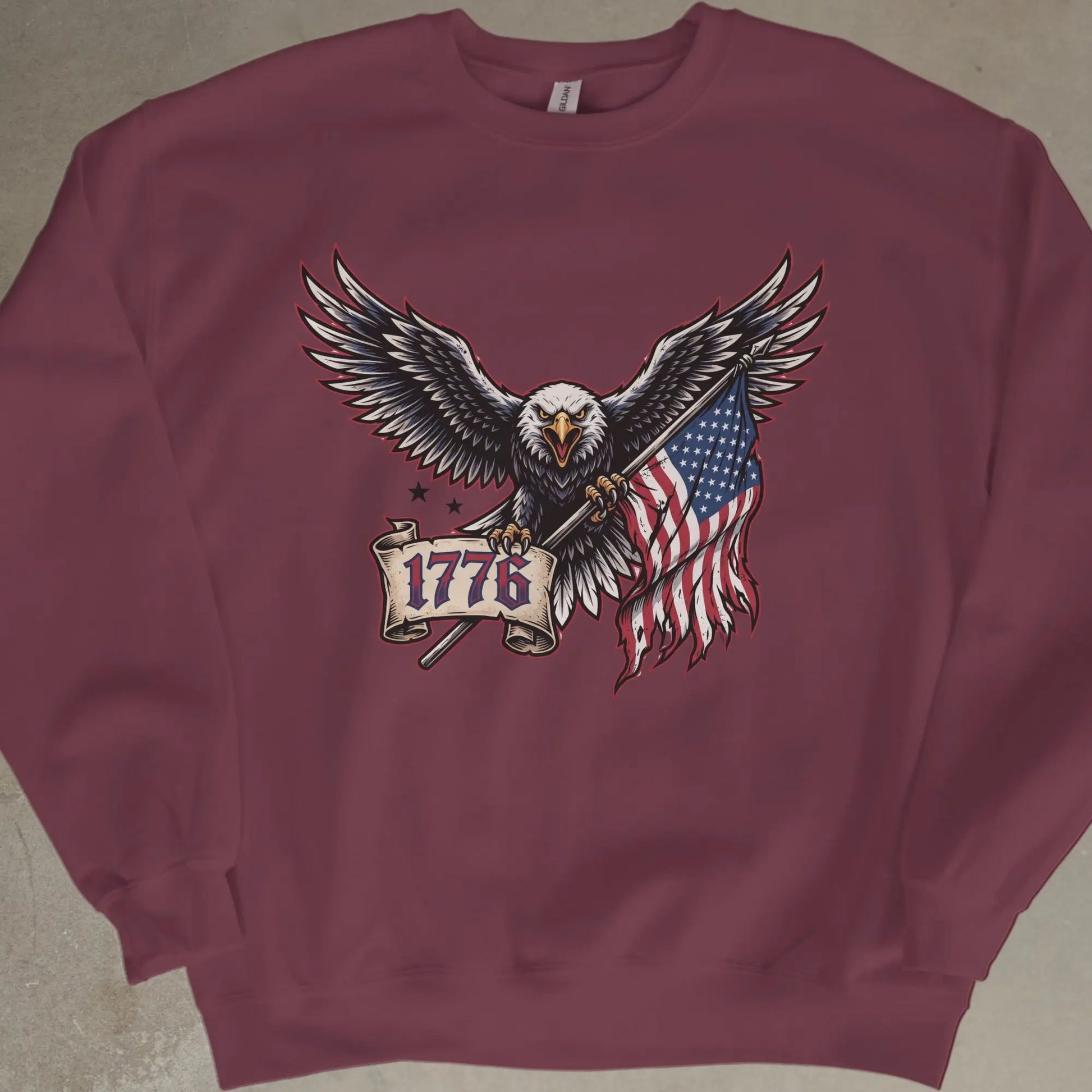 Eagle clutching American flag and banner with text "1776".