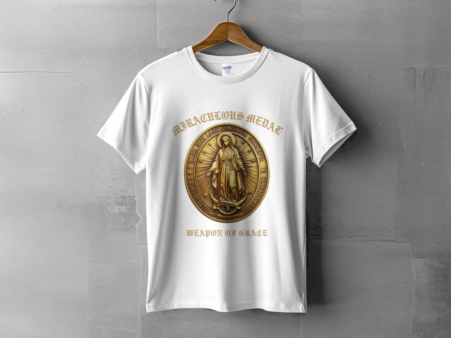 White t-shirt with "Miraculous Medal" and "Weapon of Grace" text.