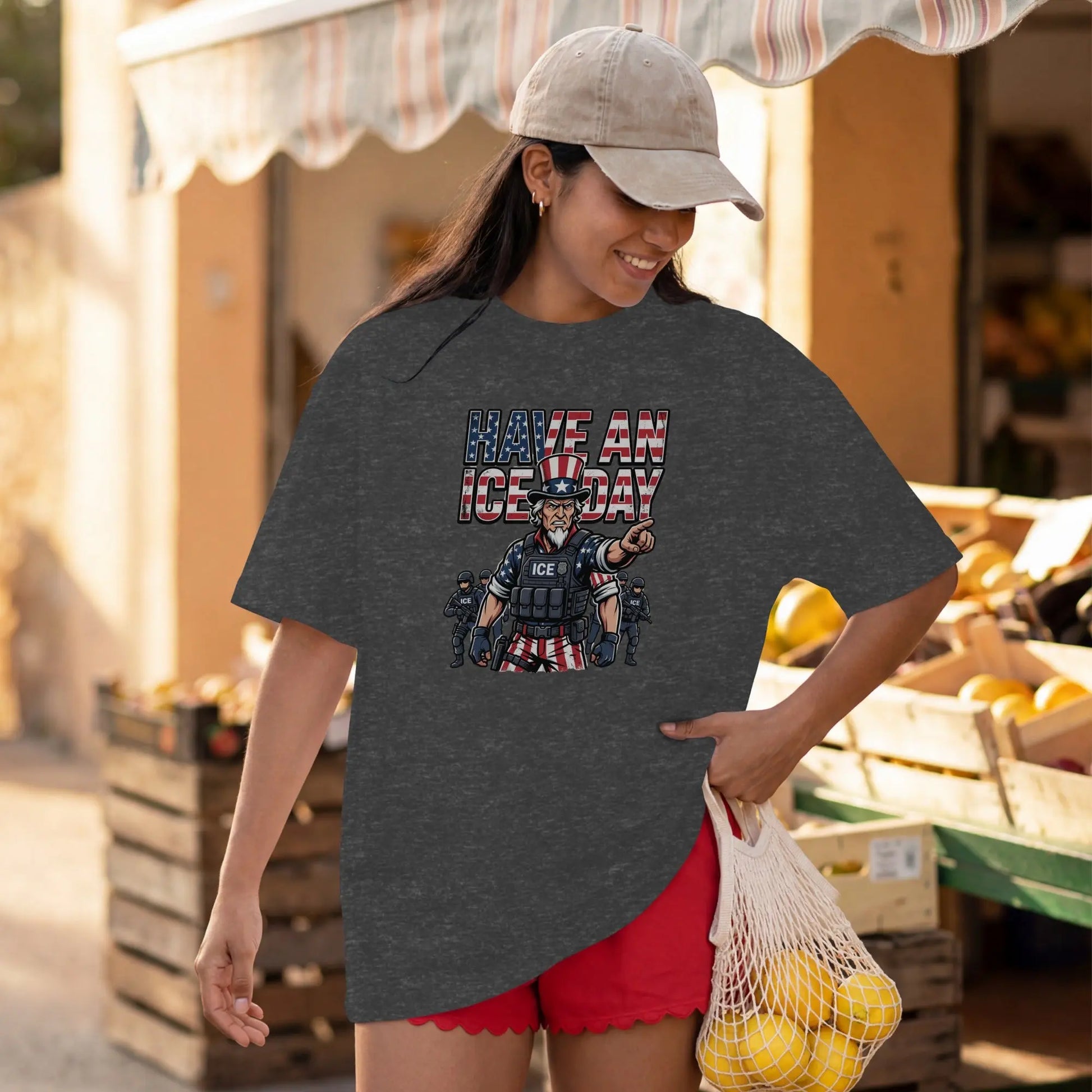 Dark t-shirt with a graphic of Uncle Sam pointing and text "Have An ICE Day".