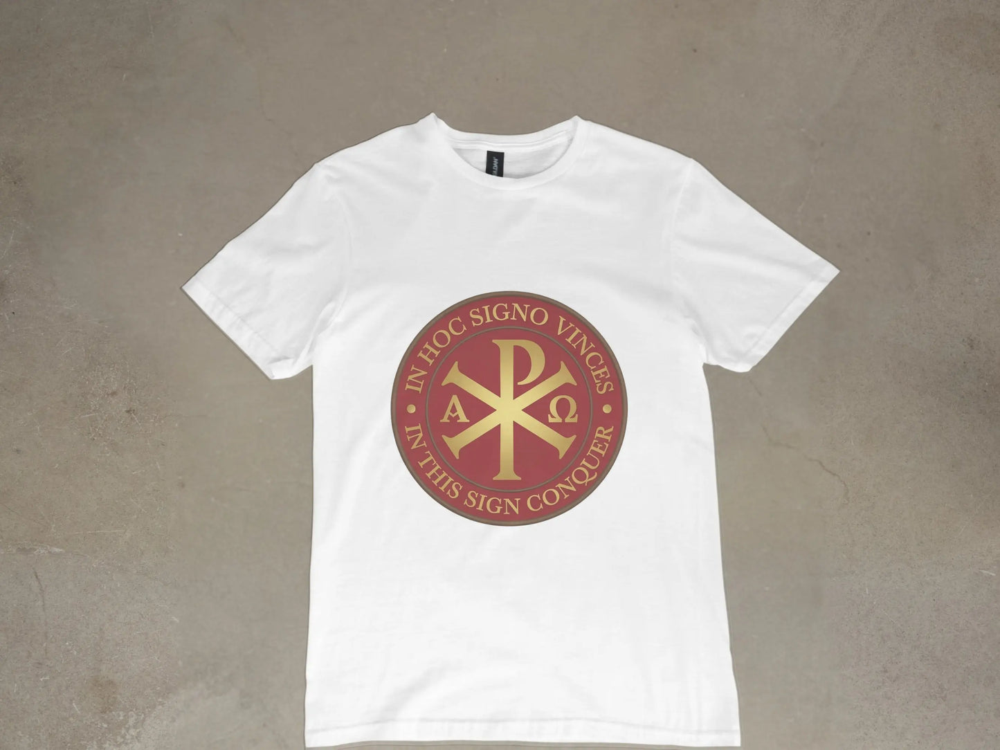 White t-shirt with a crimson circular emblem featuring Chi Rho, Alpha, and Omega symbols.