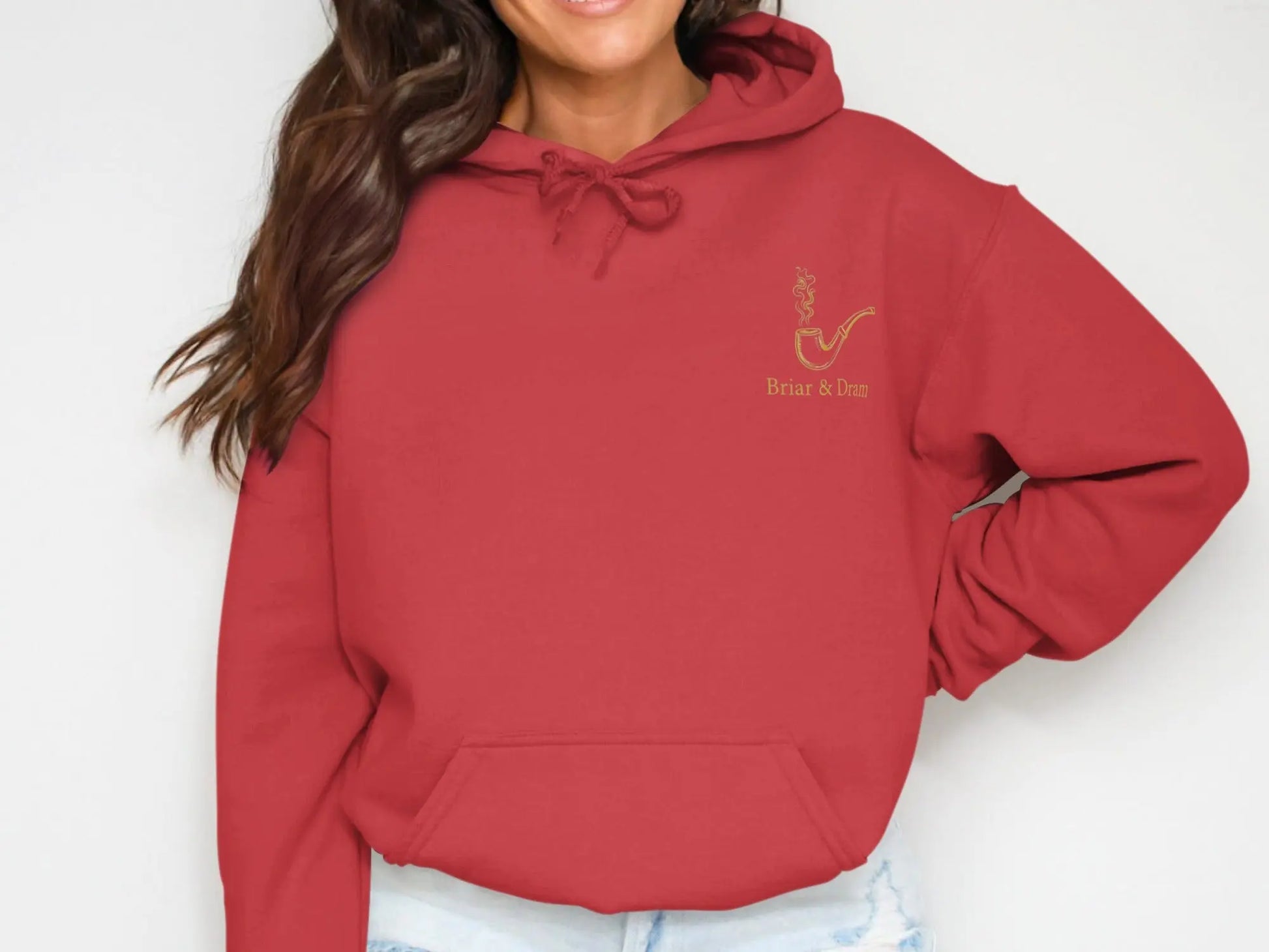 Red hoodie with gold embroidered pipe and "Briar & Dram" text graphic.