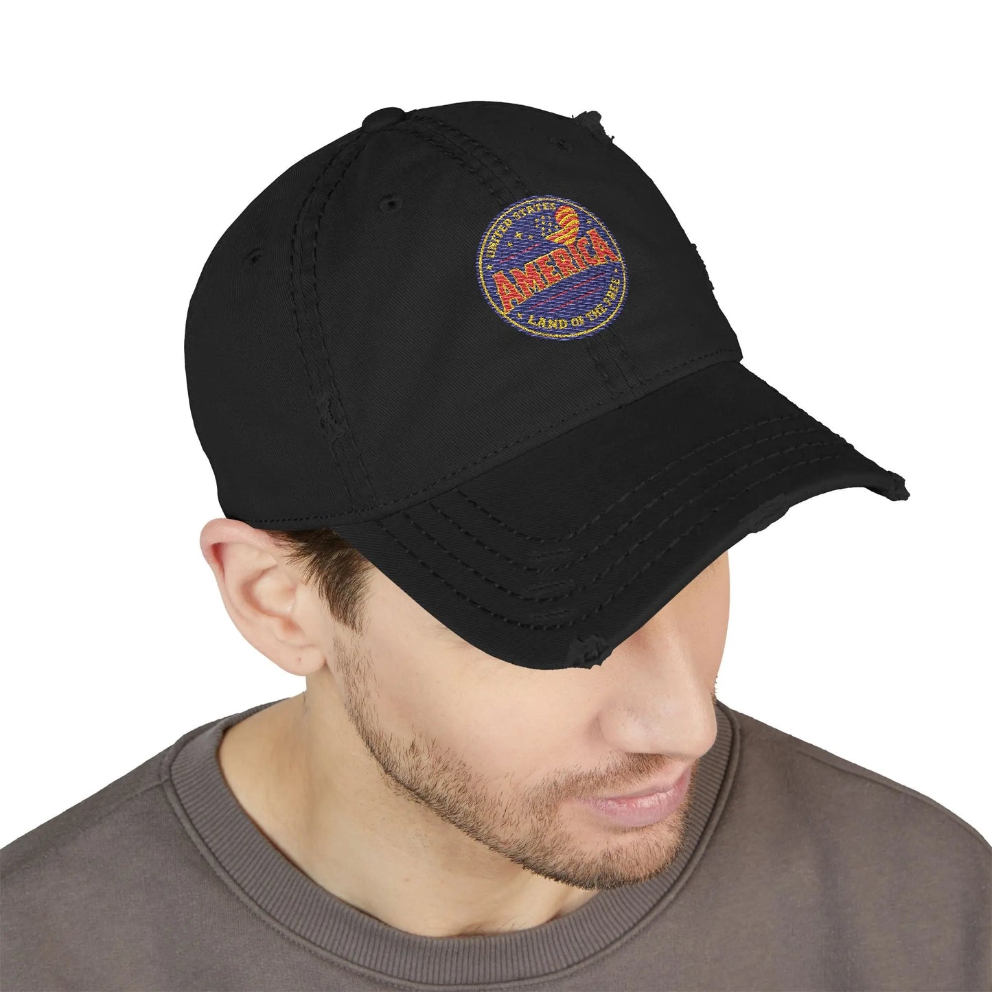 Distressed black baseball cap with embroidered "America Land of the Free" patch.