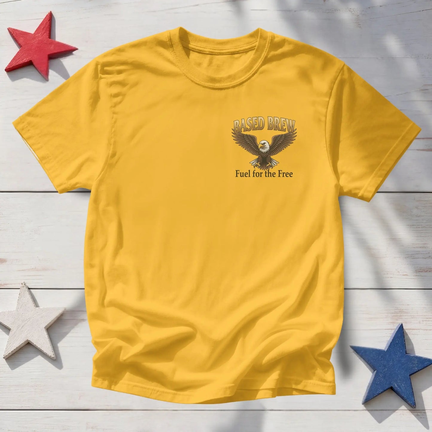 Yellow t-shirt with an eagle graphic and text "Based Brew Fuel for the Free".