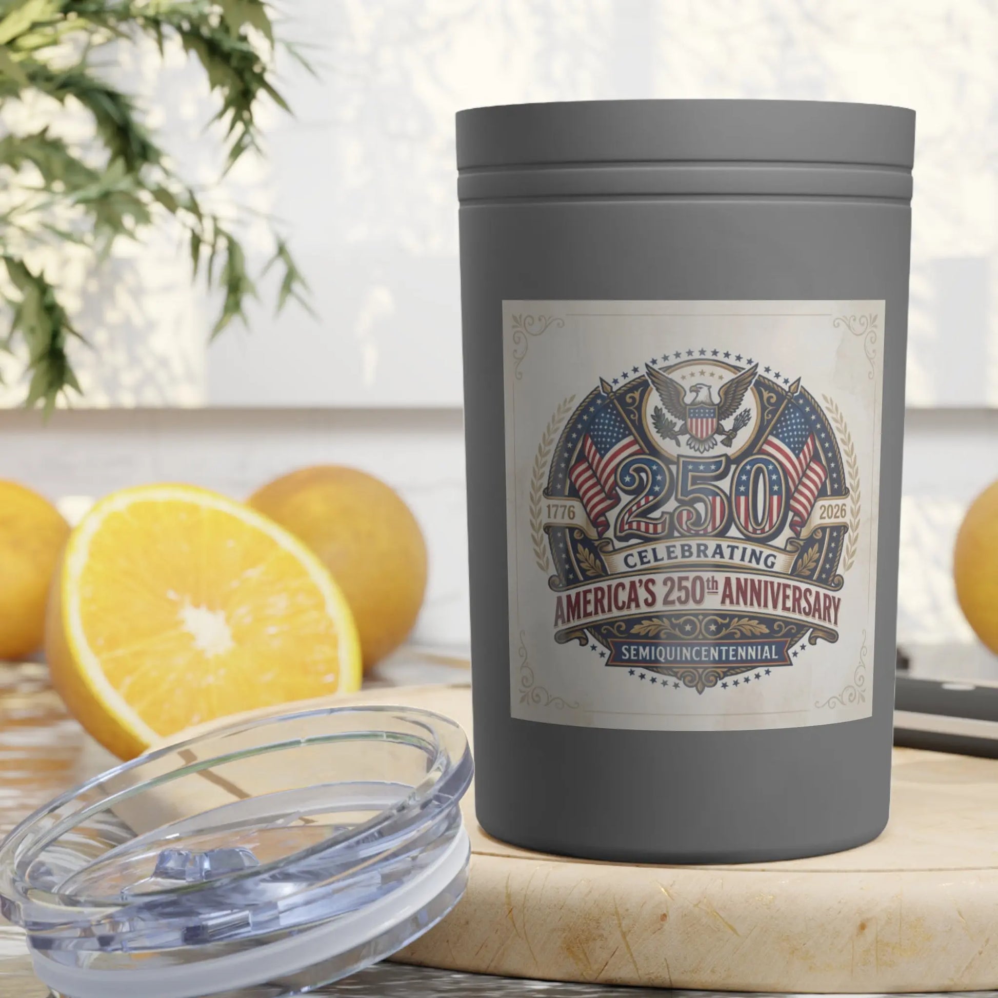 Gray tumbler with "America's 250th Anniversary" design, oranges, and lid.