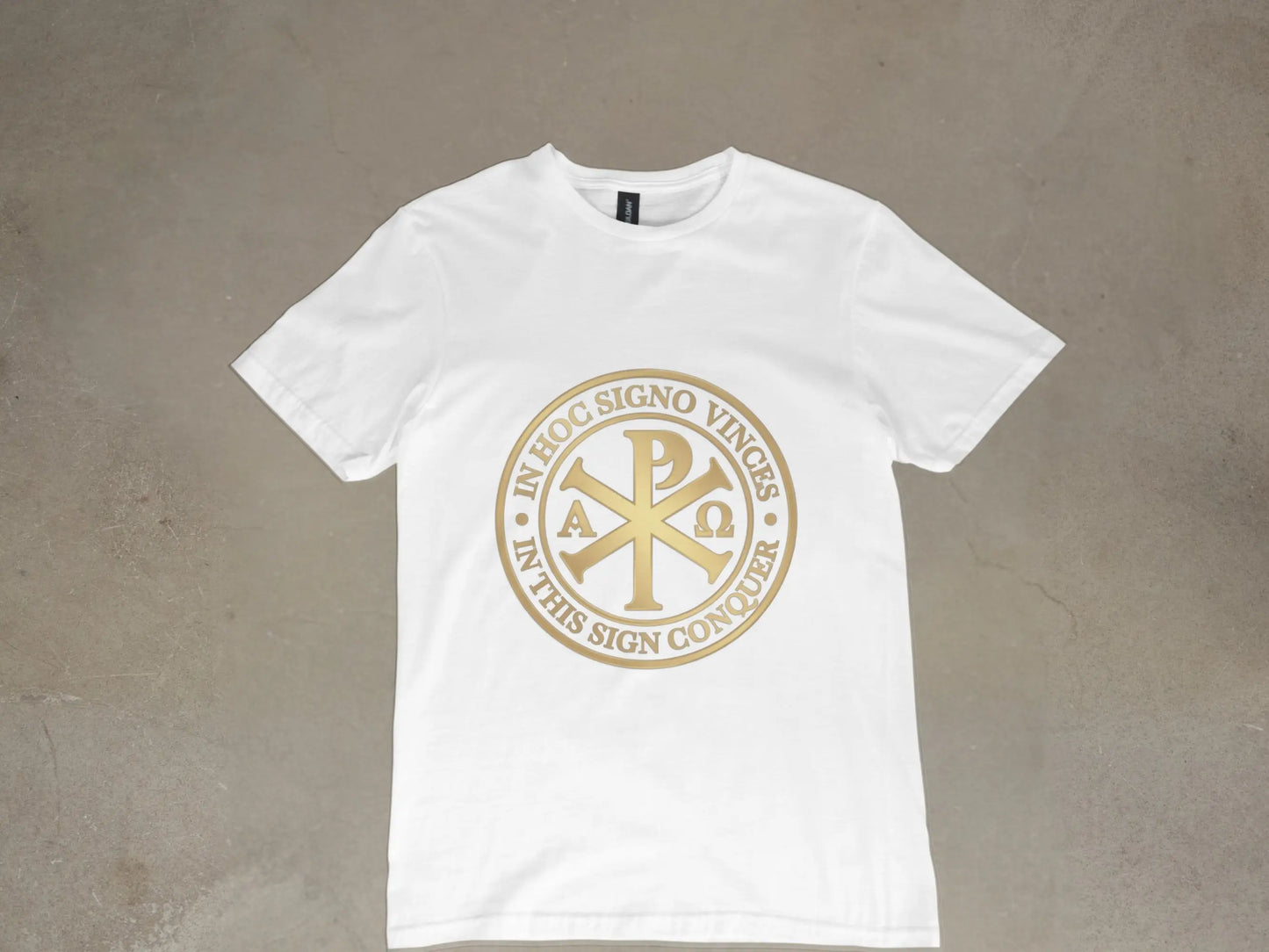 White t-shirt with gold Chi Rho symbol and "IN HOC SIGNO VINCES IN THIS SIGN CONQUER."