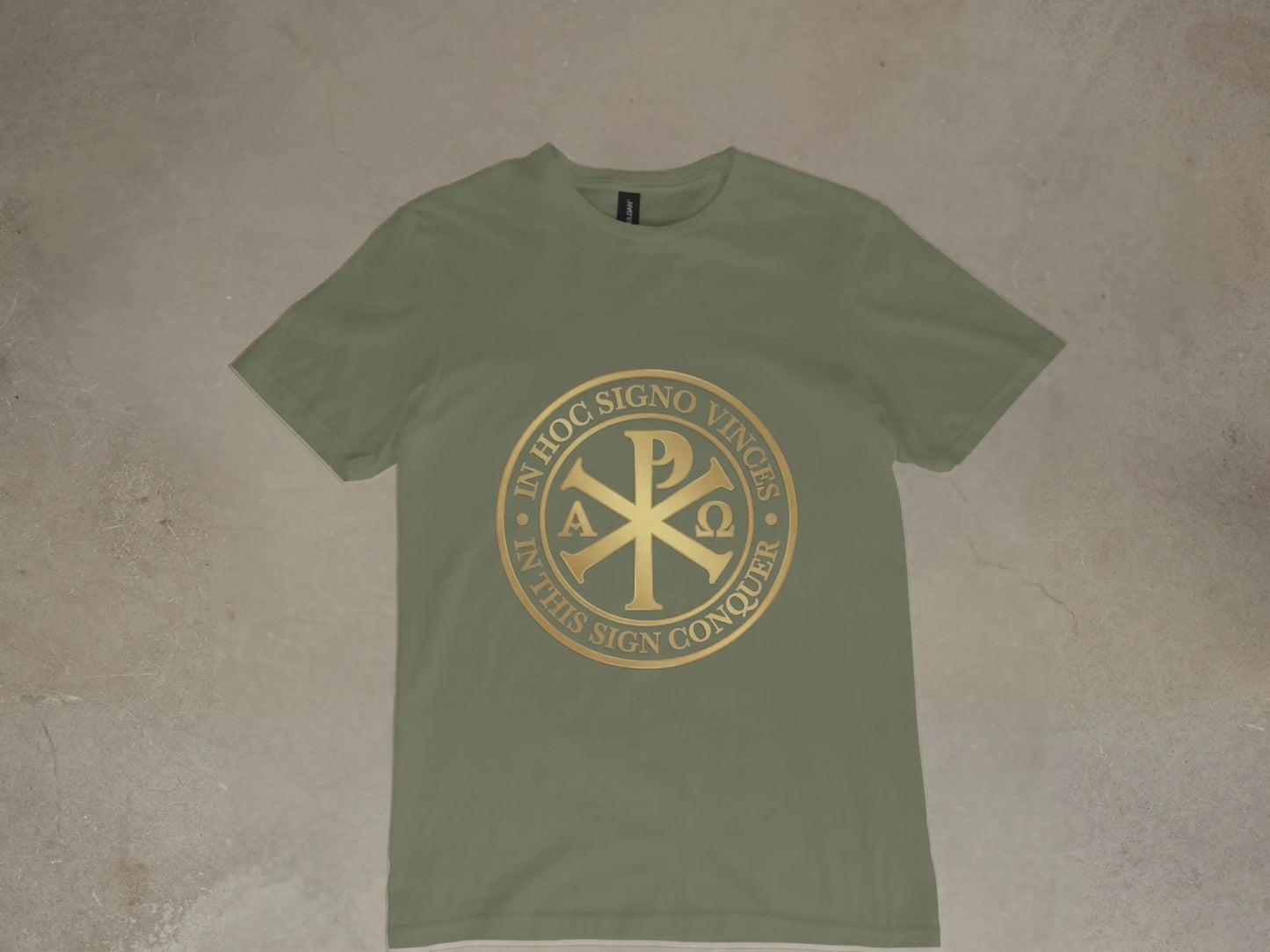 Olive green t-shirt with gold Chi Rho symbol and "In Hoc Signo Vinces" text.