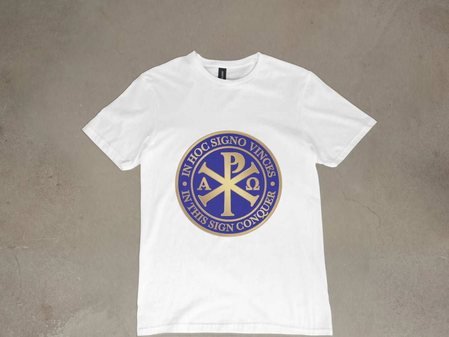 White t-shirt with a blue and gold circular emblem featuring the Chi Rho symbol and Latin text.