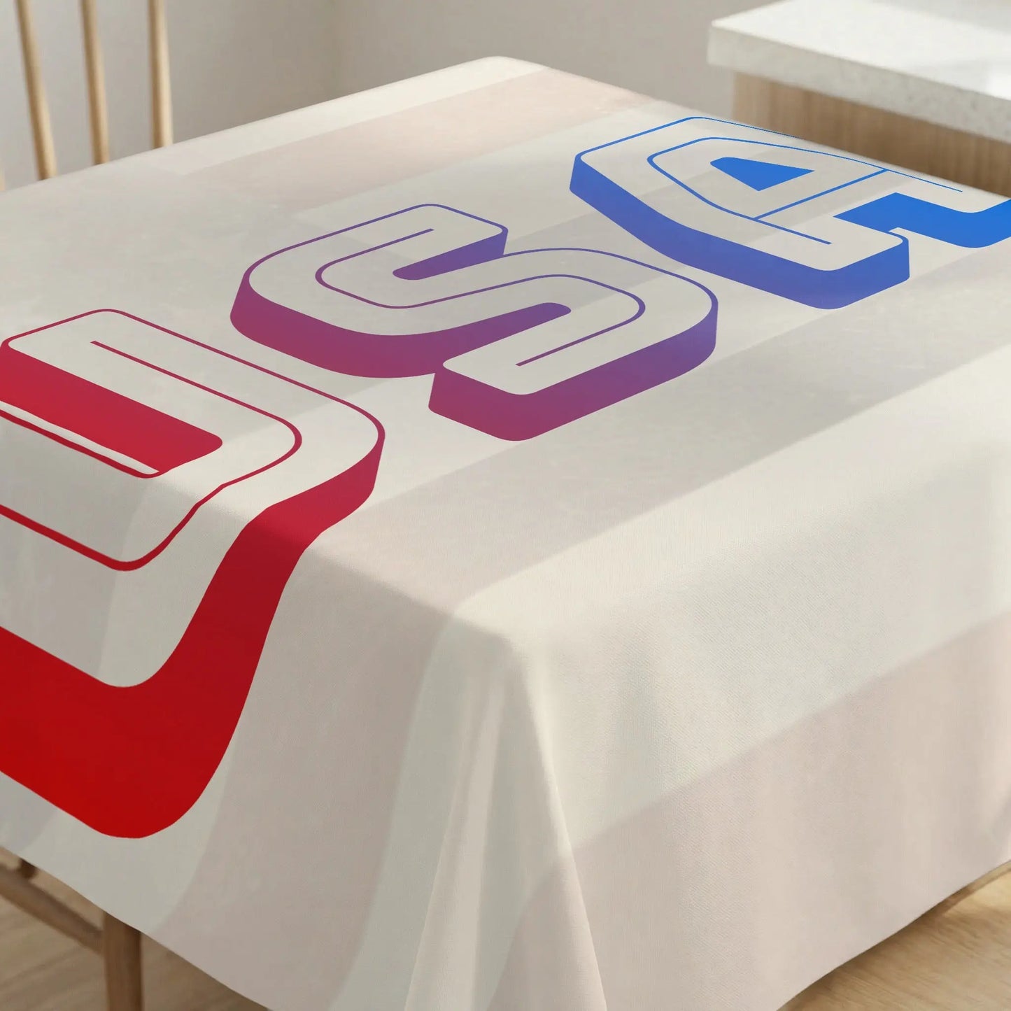 Tablecloth with large red, purple, and blue 3D "USA" text design.