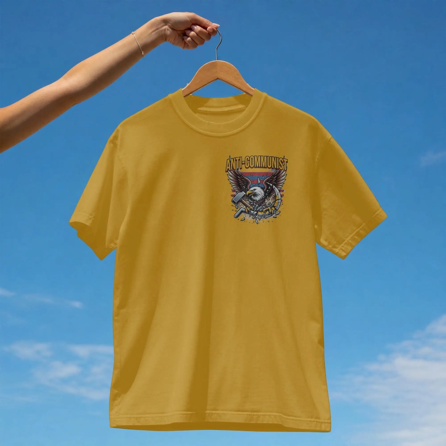 Yellow t-shirt with an eagle and hammer graphic.