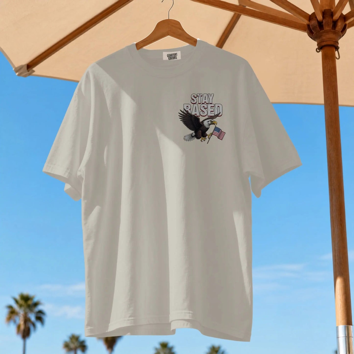 White t-shirt with eagle, American flag, and "STAY BASED" text.