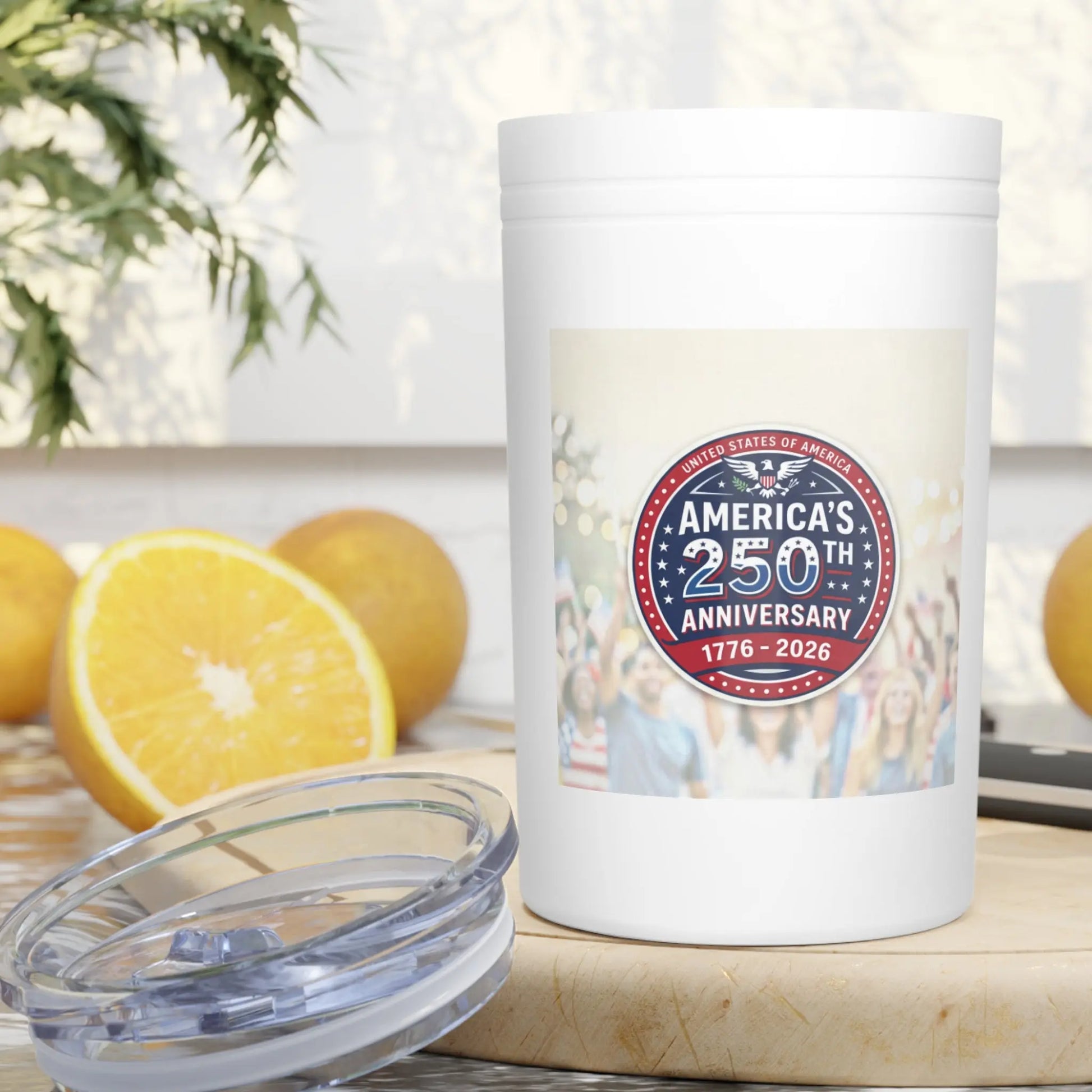 White tumbler with America's 250th Anniversary 1776-2026 logo and oranges.