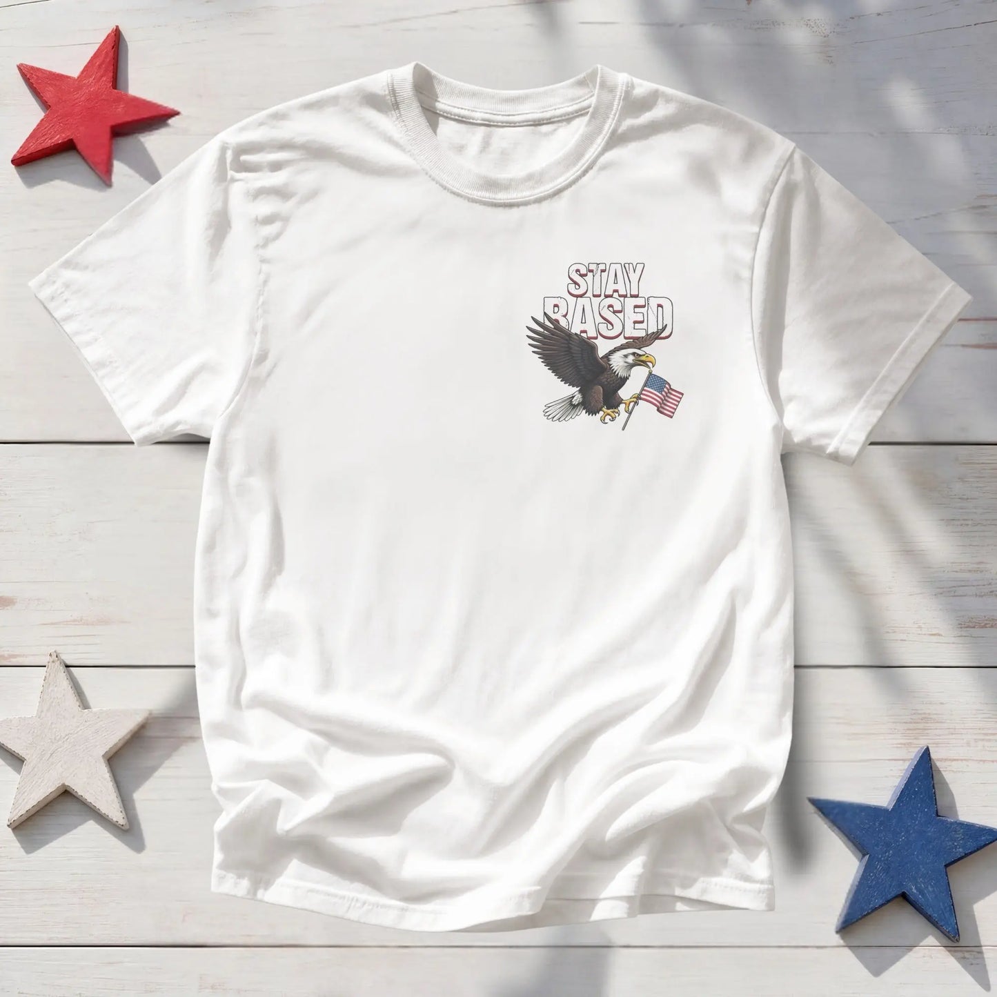 White t-shirt with an eagle holding the American flag and "STAY BASED" text.