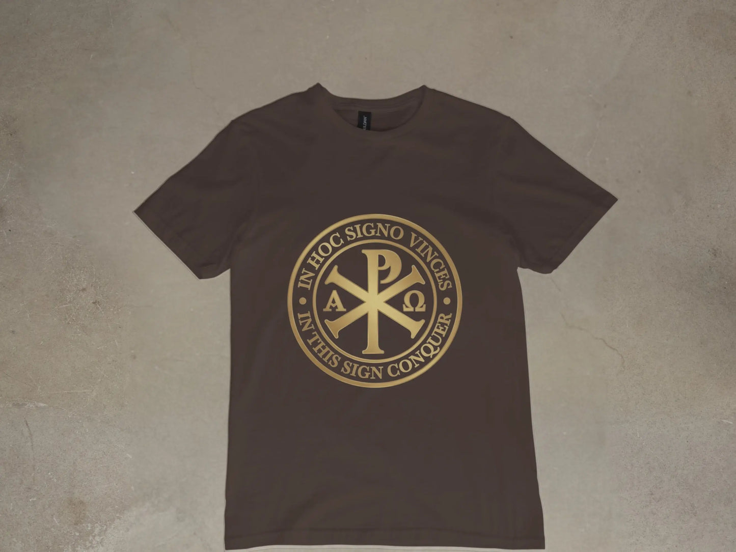 Brown t-shirt with gold Chi-Rho symbol and Latin text: "In Hoc Signo Vinces."