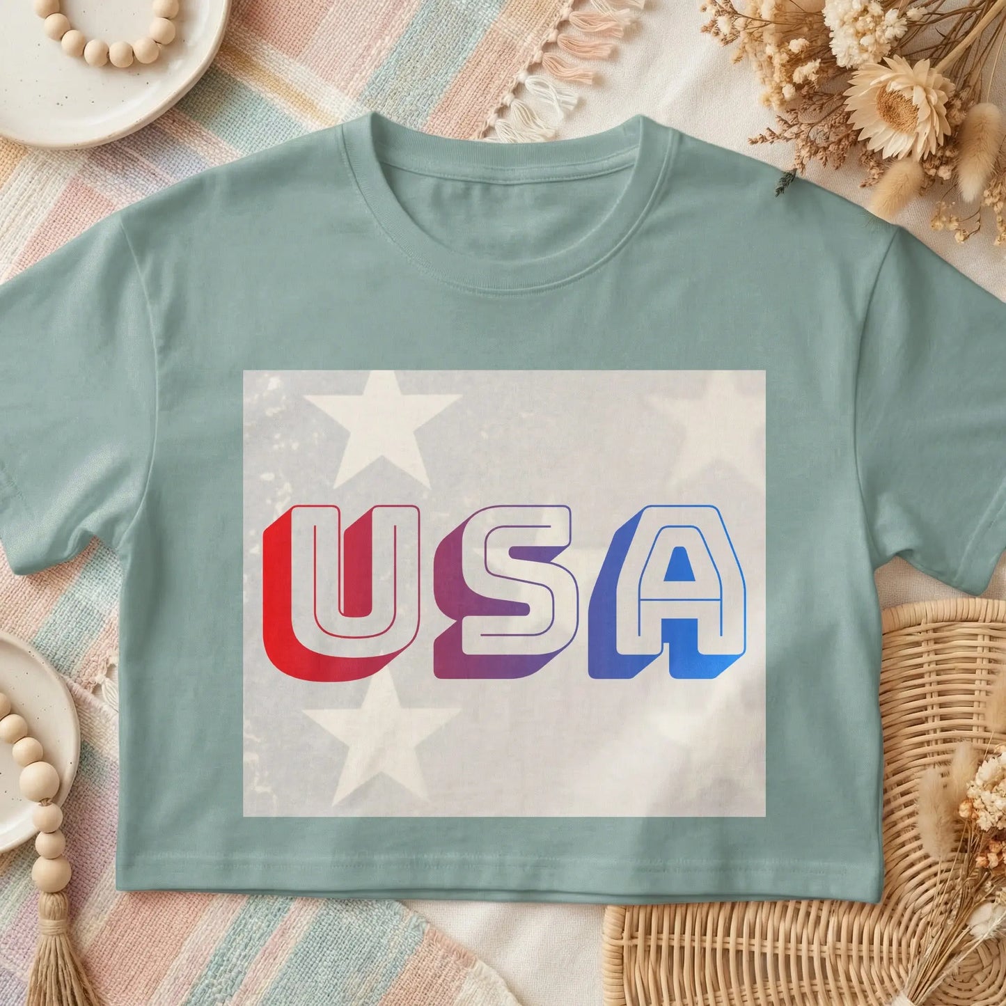 Light blue t-shirt with 3D red, purple, and blue "USA" text overlay.