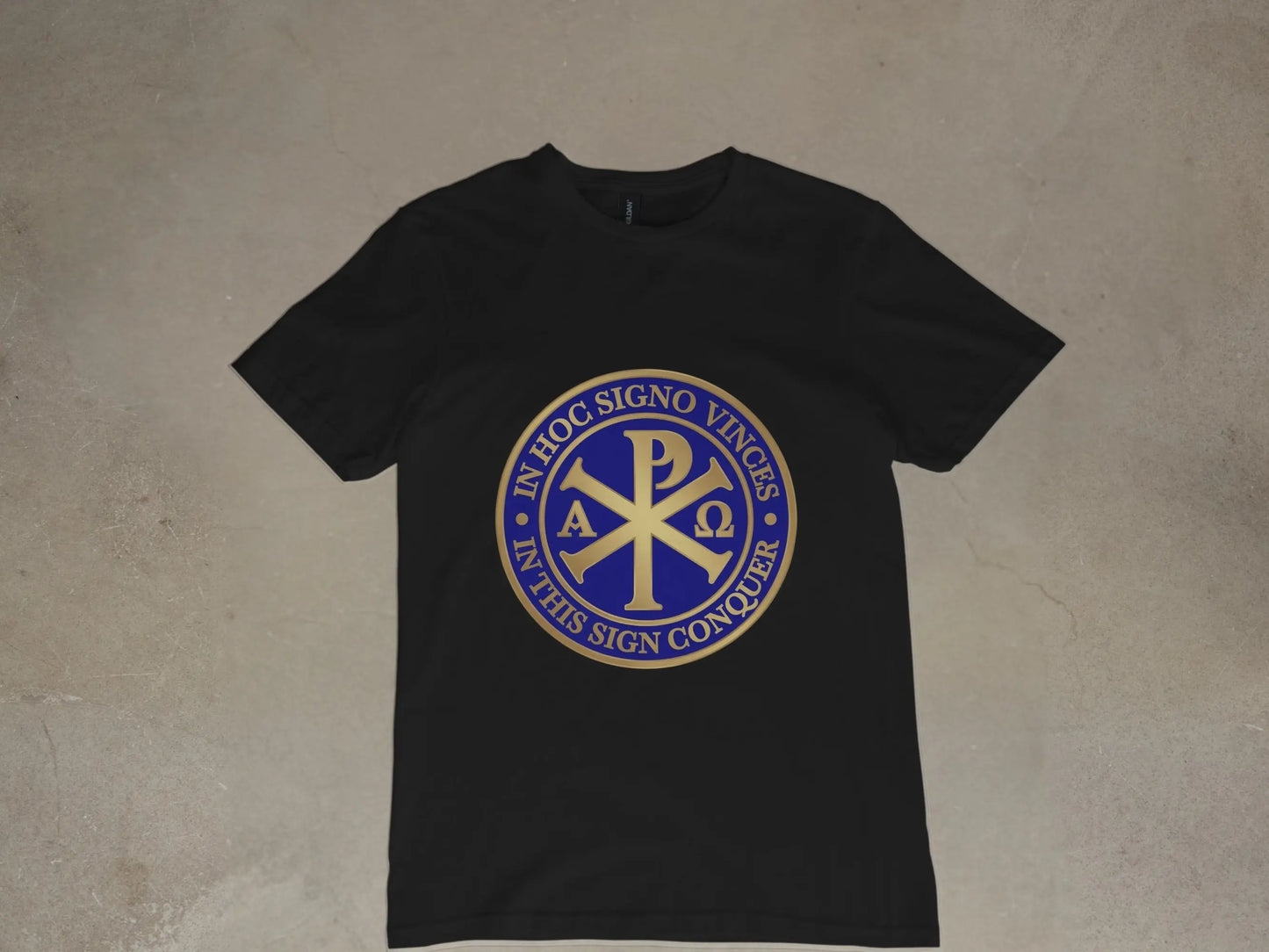 Black t-shirt with a blue and gold Chi Rho symbol and Latin text.