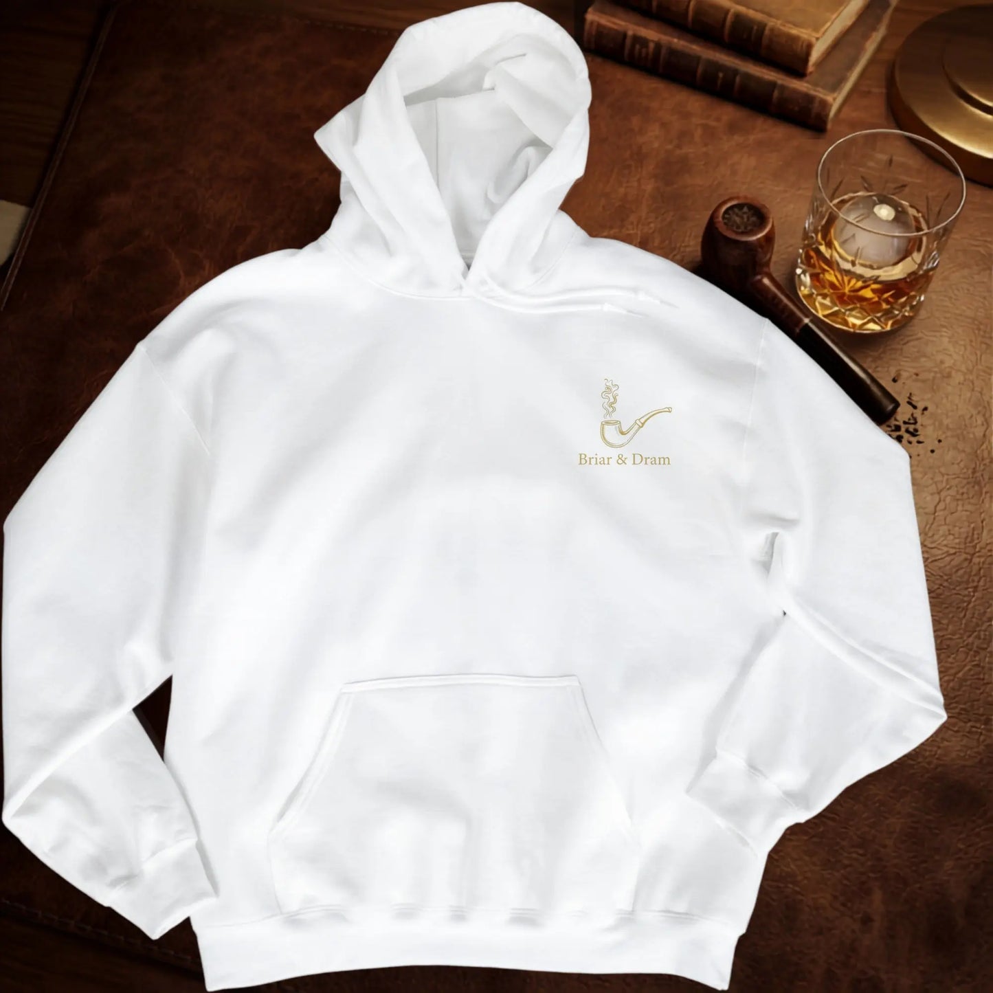 White hoodie with gold embroidered pipe and "Briar & Dram" text.
