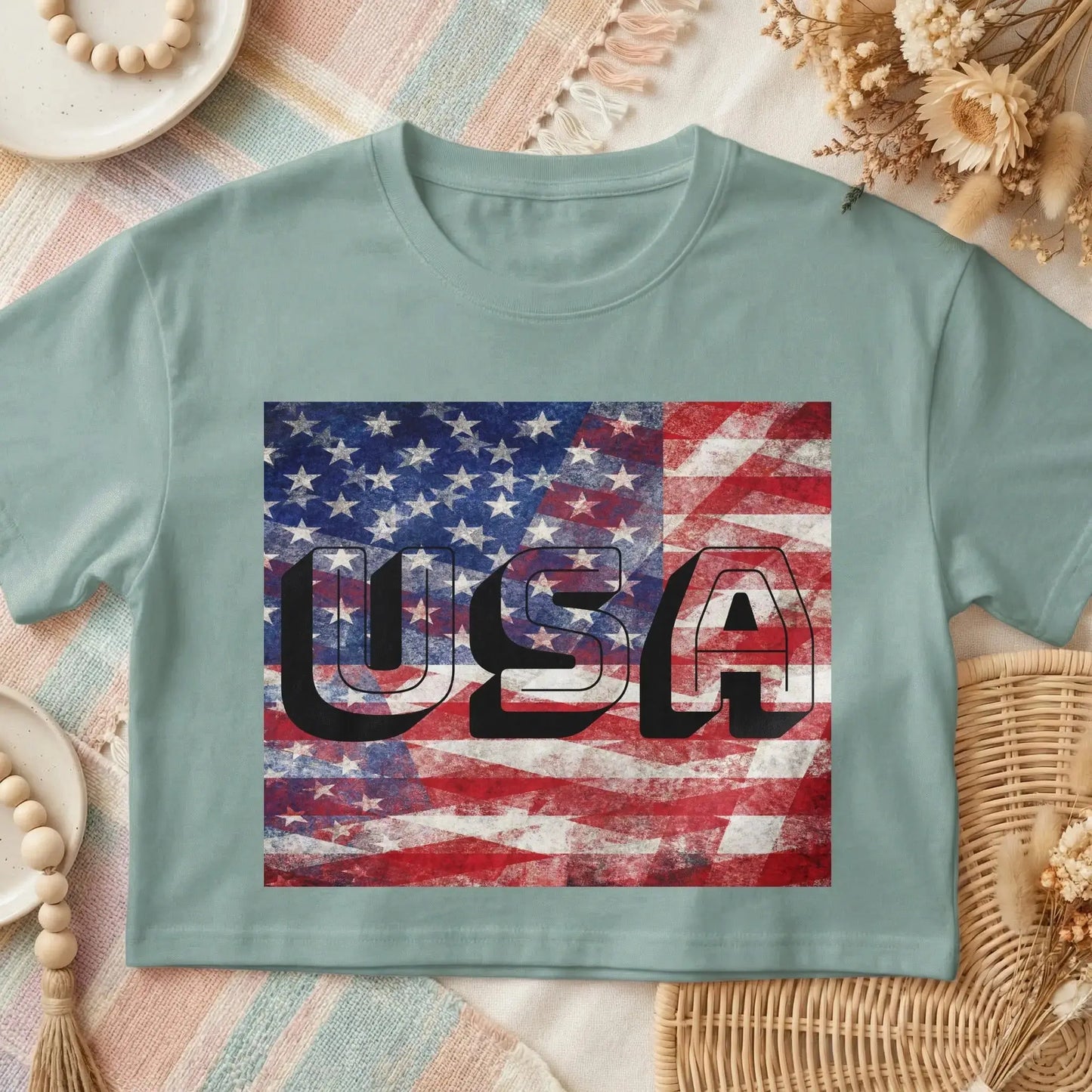 T-shirt featuring distressed US flag graphic with bold black "USA" text.