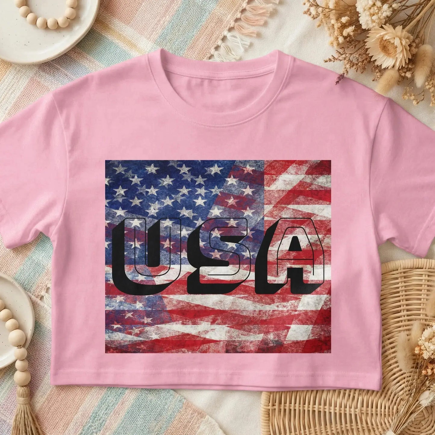 Pink crop top with distressed USA graphic featuring the American flag.