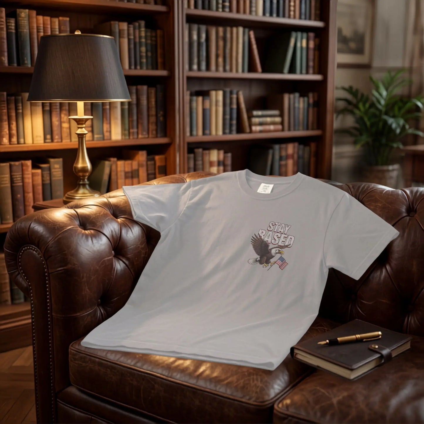 Light gray t-shirt with eagle and American flag graphic, text "STAY BASED".