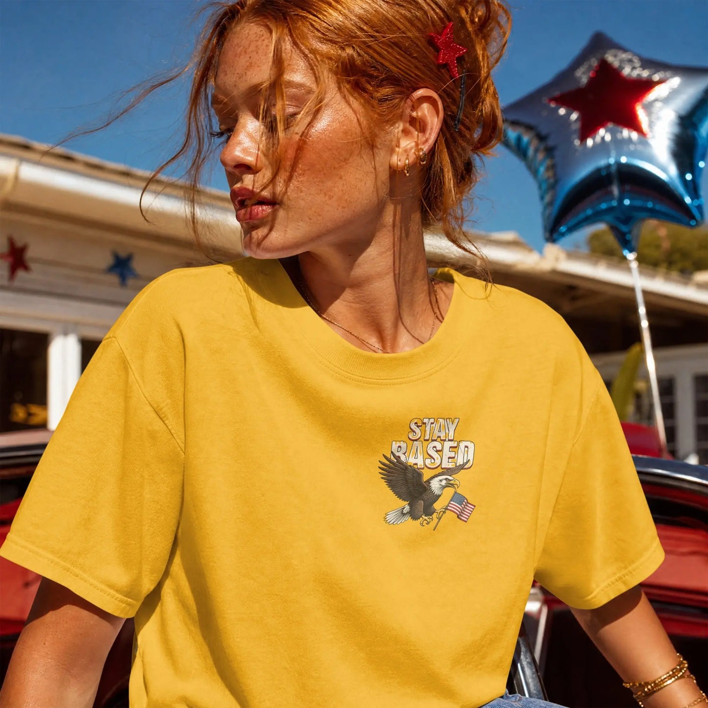 Yellow t-shirt with eagle and flag graphic and "STAY BASED" text.
