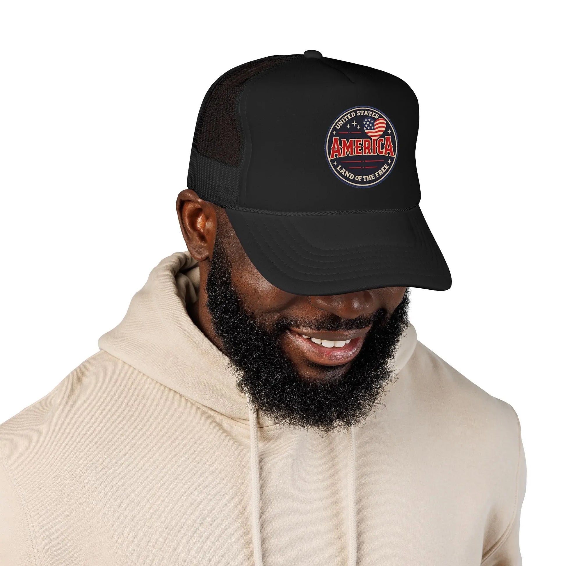 Black trucker hat with embroidered United States America Land of the Free graphic.