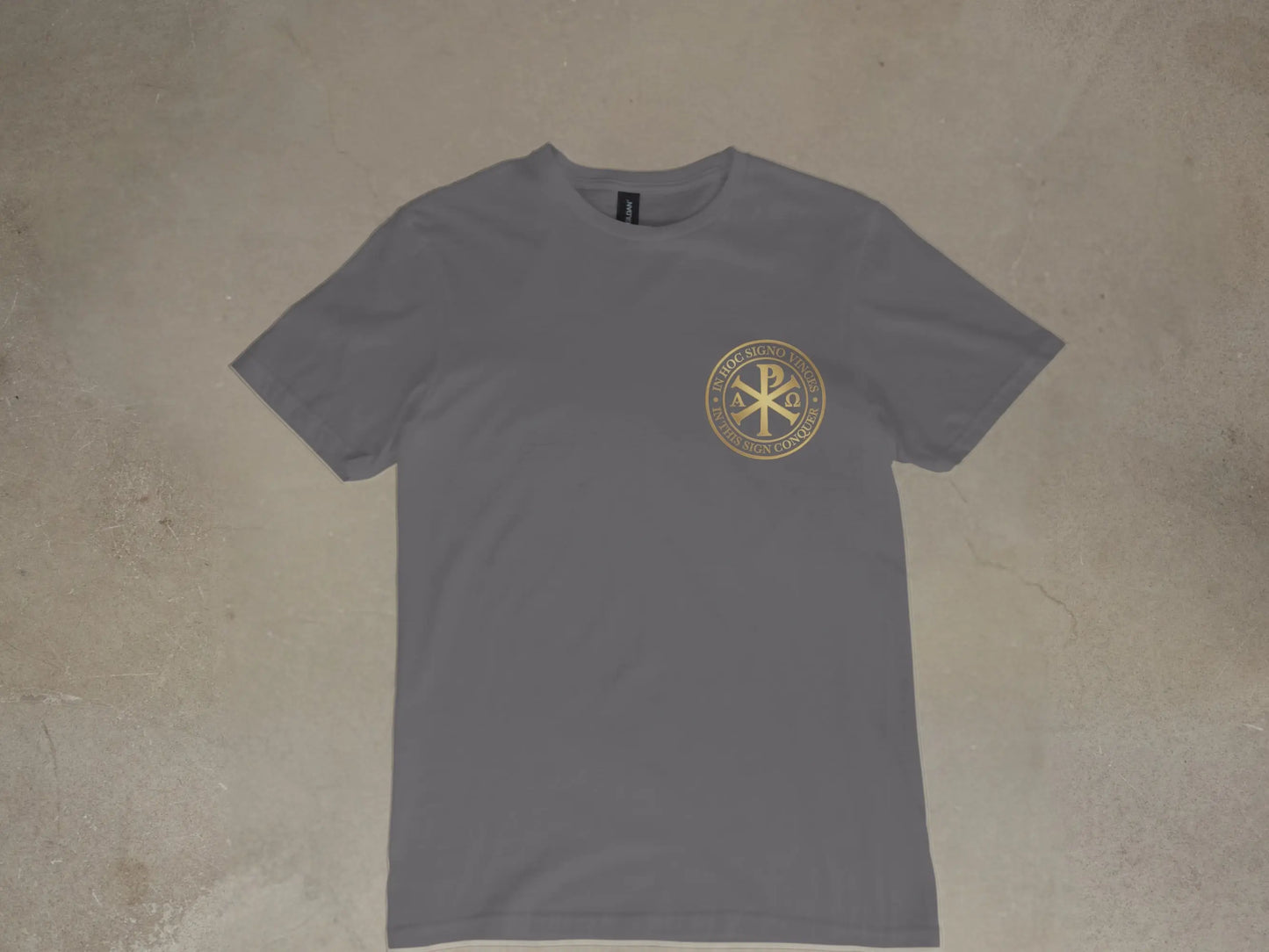 Grey t-shirt with gold Chi Rho symbol and Latin text "In Hoc Signo Vinces".