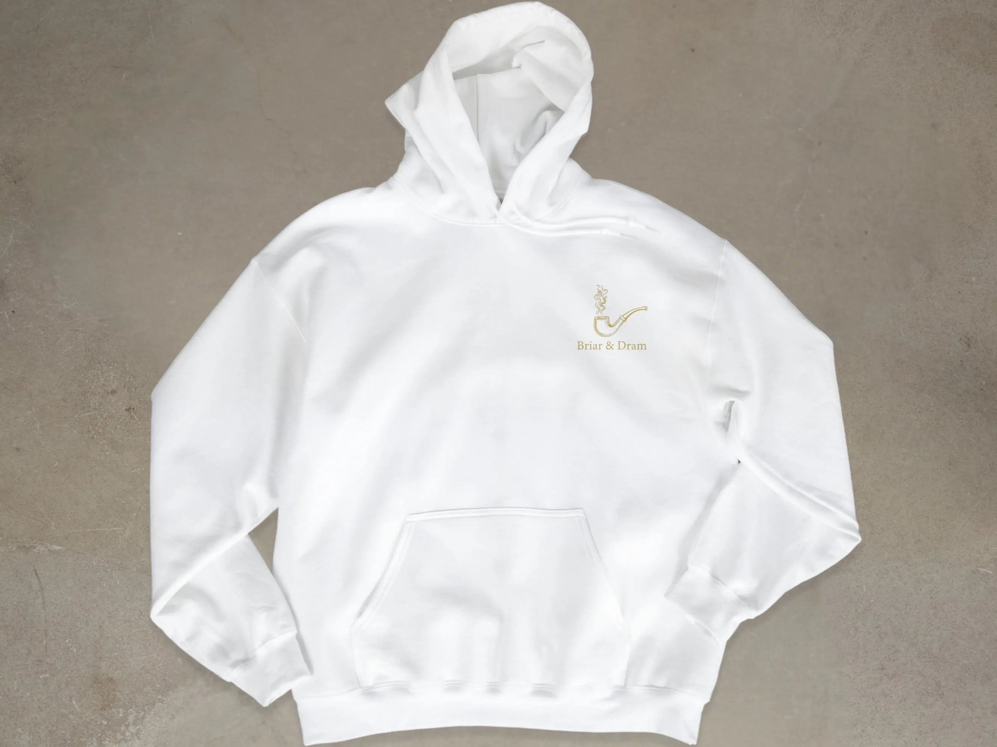 White hoodie with a gold smoking pipe and "Briar & Dram" text logo.