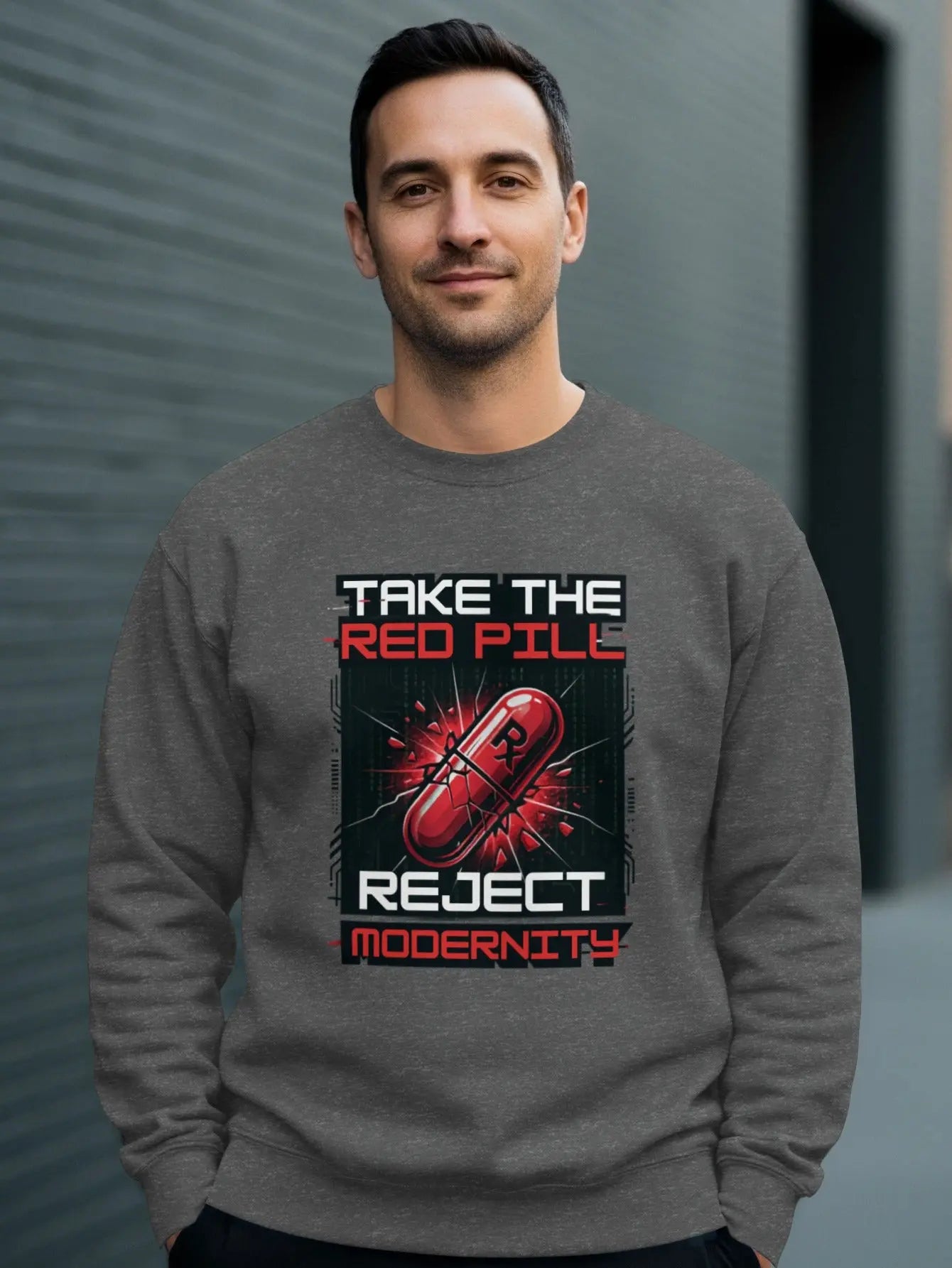 Man wearing grey sweatshirt with "Take the Red Pill Reject Modernity" text and graphics.
