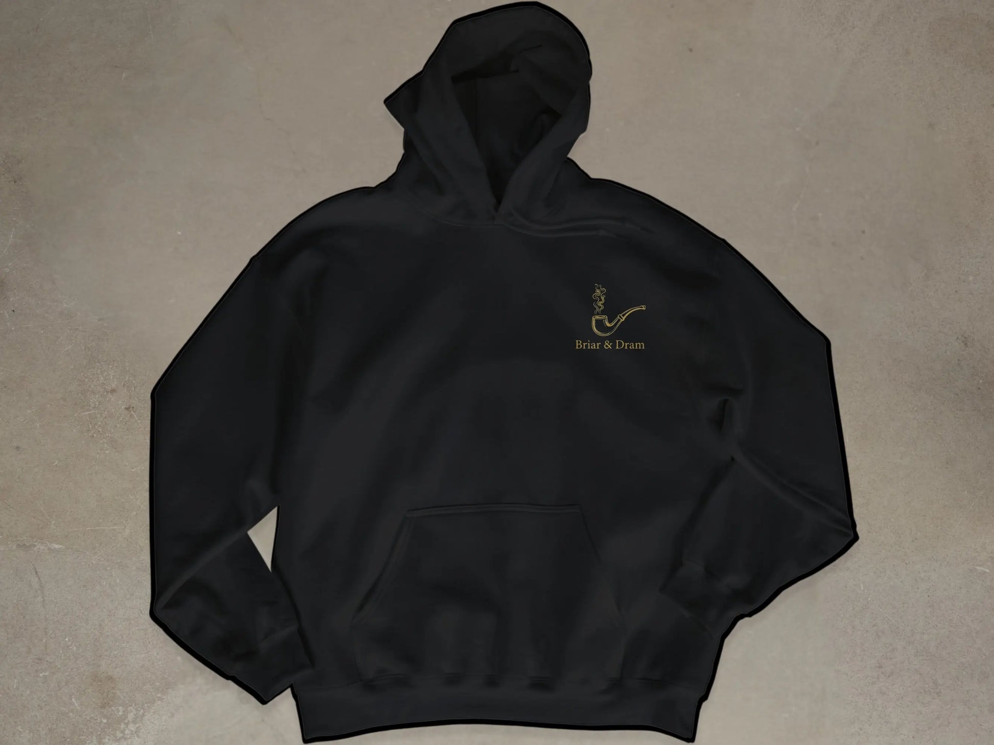 Black hoodie with gold smoking pipe logo and "Briar & Dram"text.