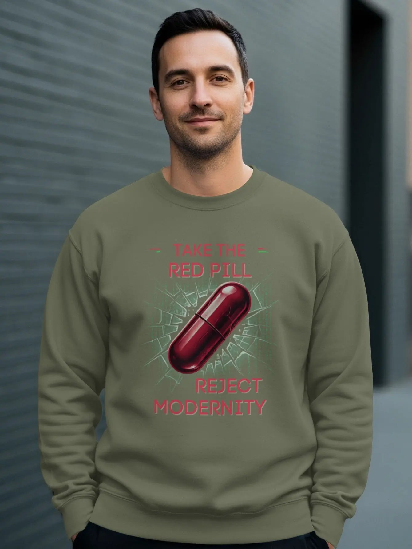 Olive green sweatshirt with a red pill and text: "Take the Red Pill, Reject Modernity."