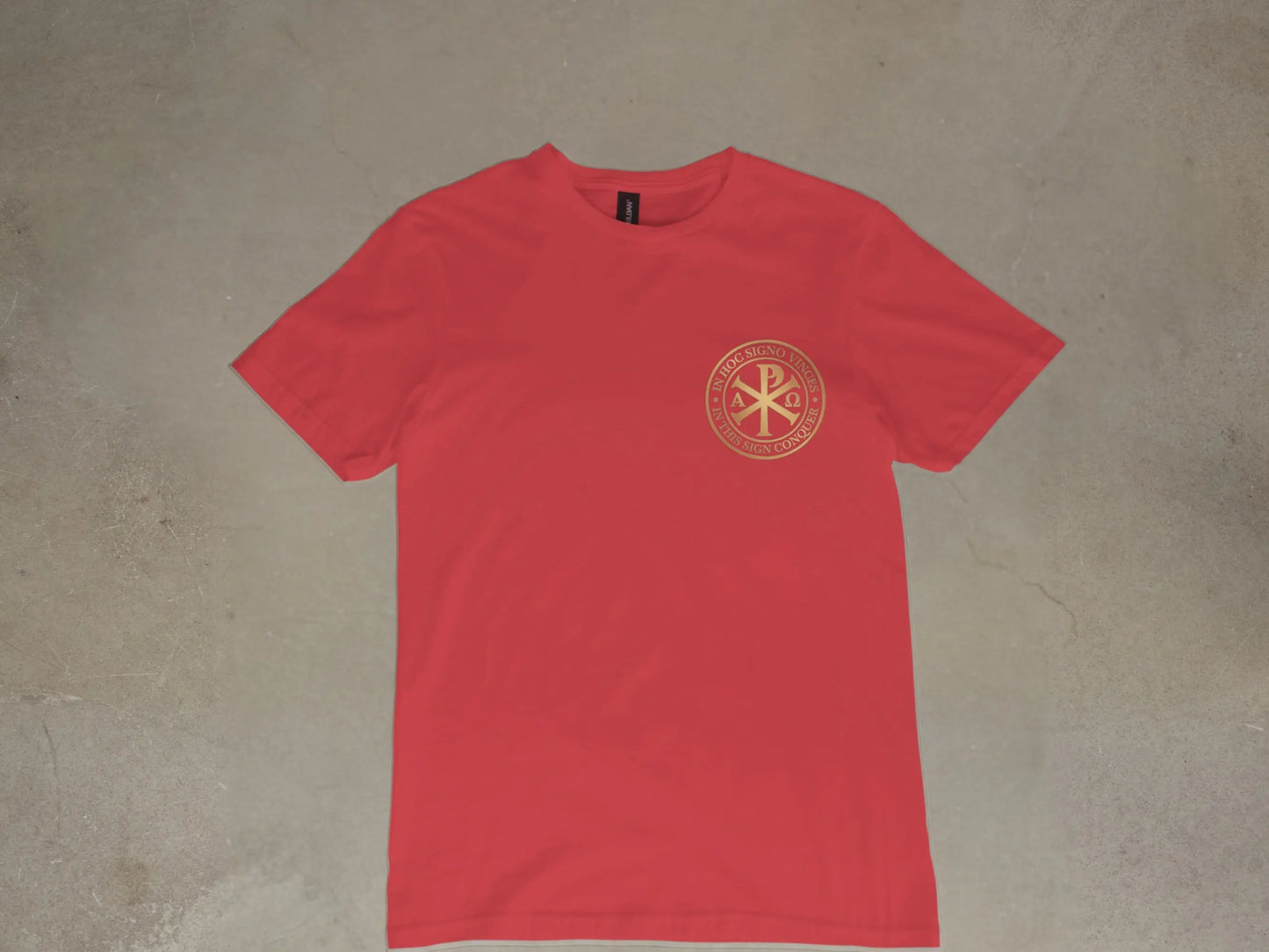 Red t-shirt with gold Chi Rho symbol and Latin inscription on chest.