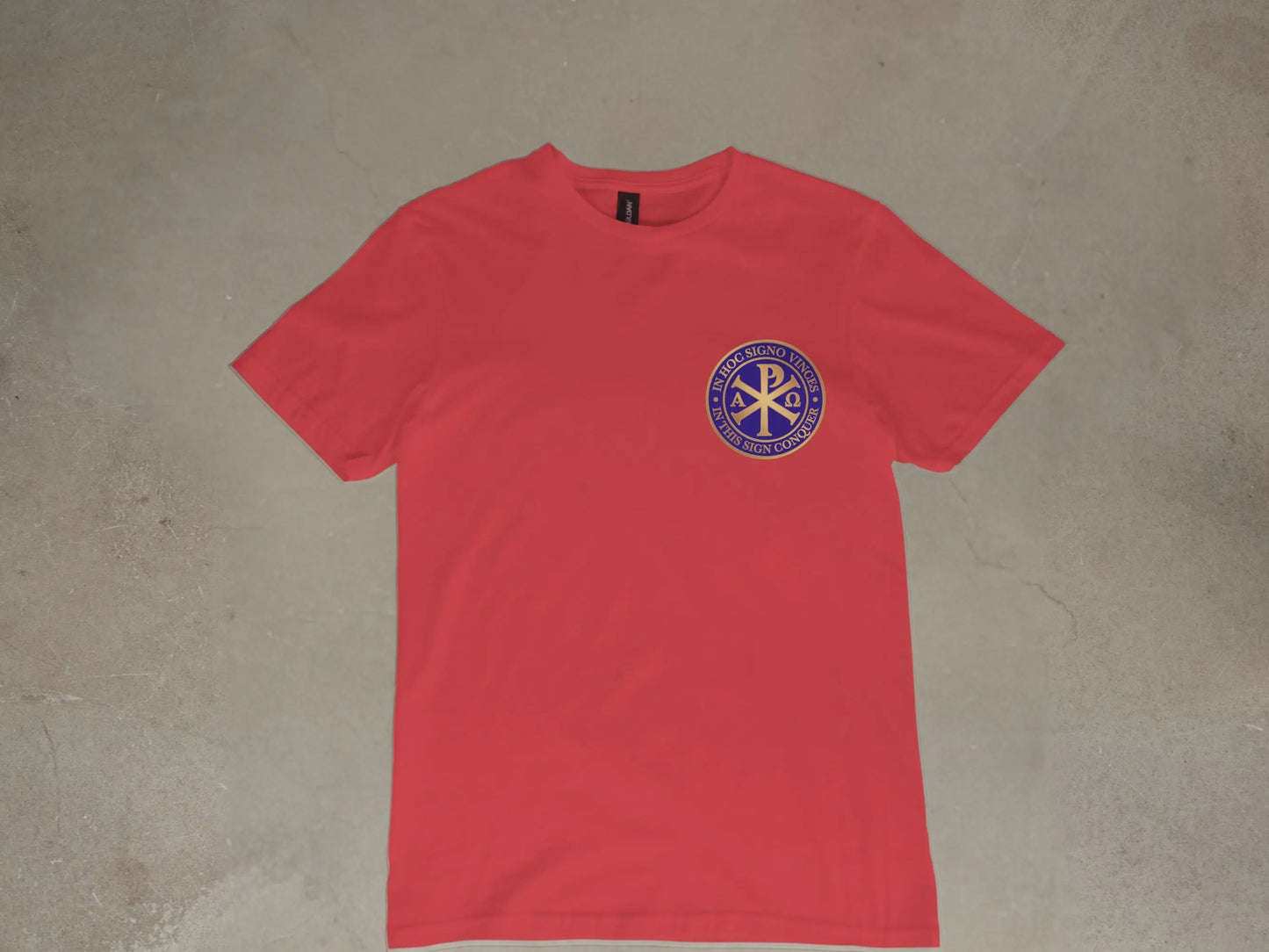 Red t-shirt with blue circular emblem and Latin text.